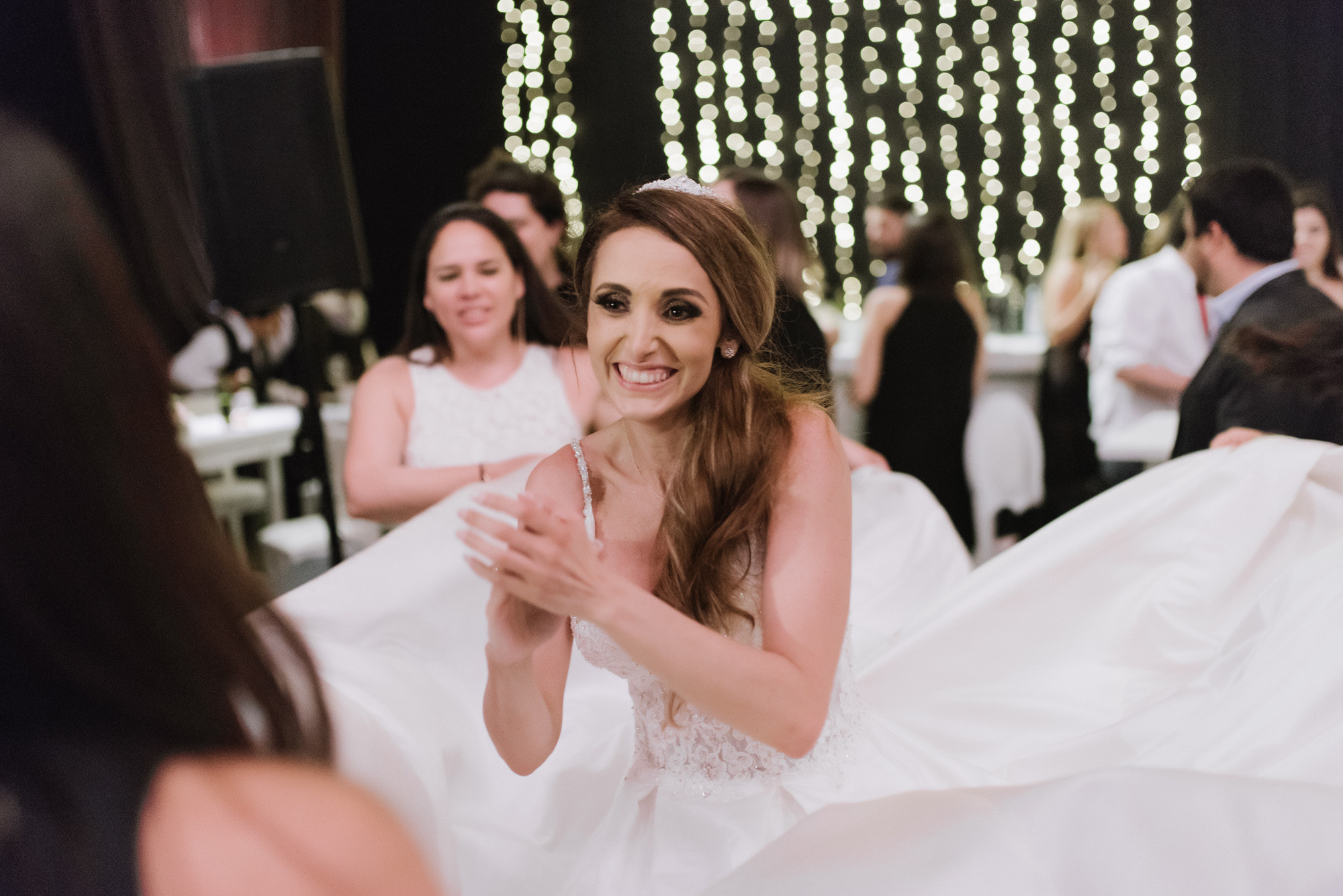 a woman in a white dress is dancing