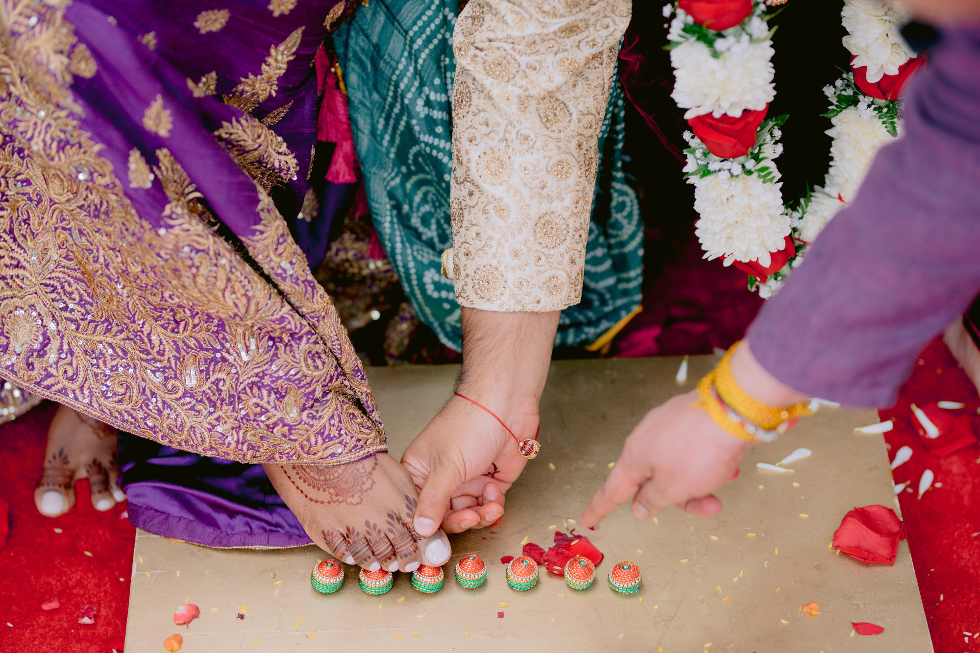 a couple cutting a cake with a knife