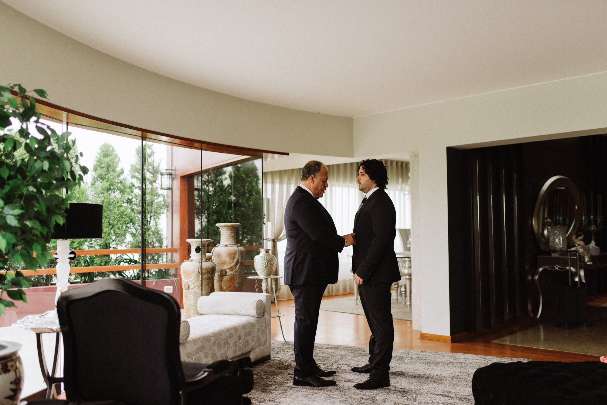 two men in a living room talking