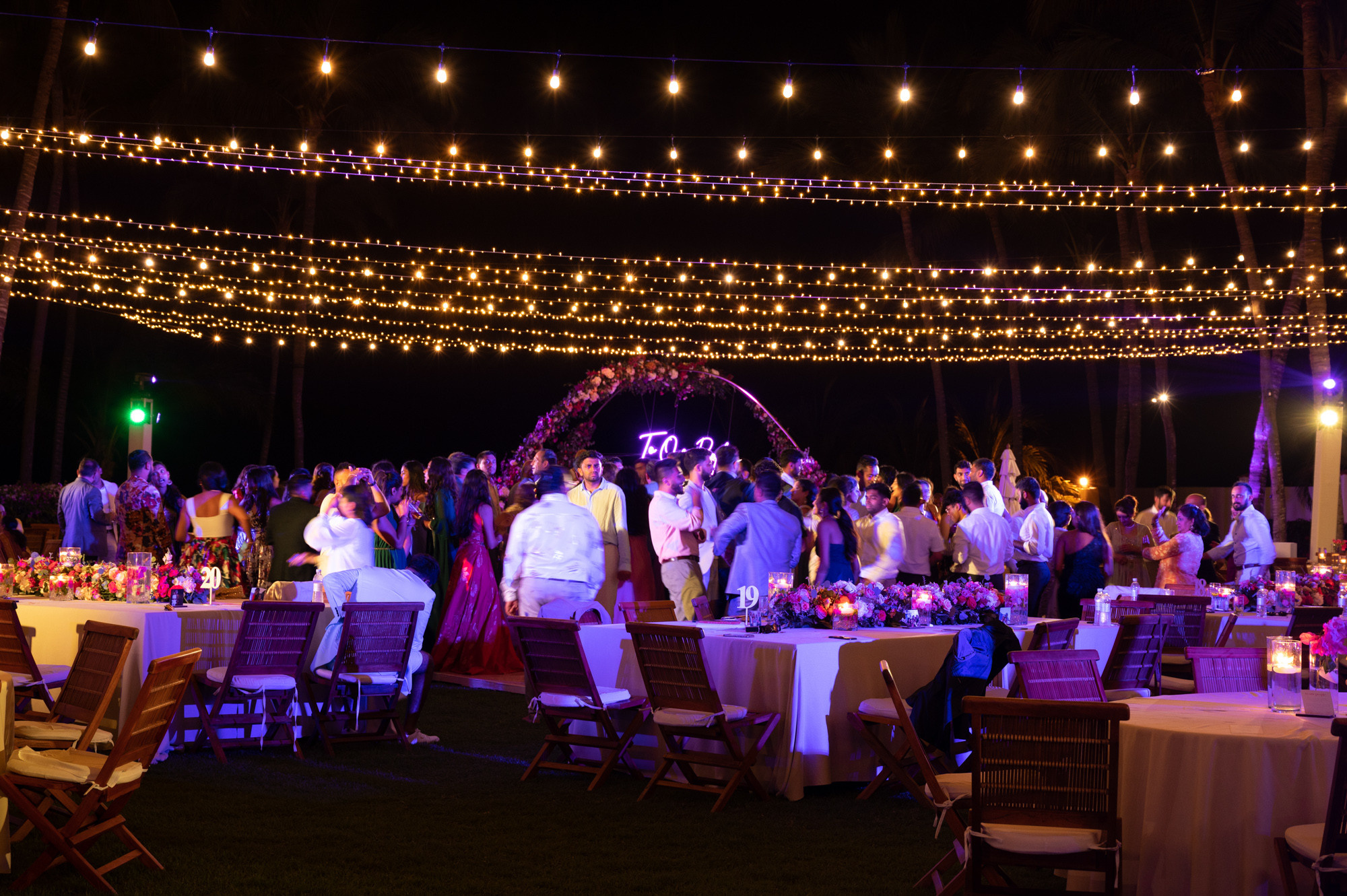 a group of people standing around a table