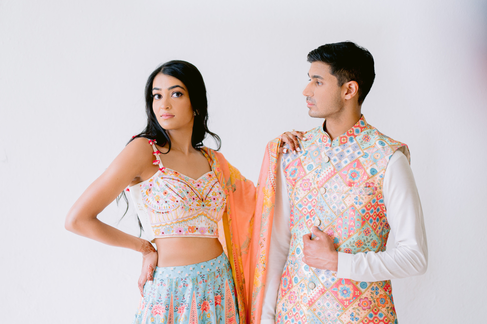 a man and woman in colorful outfits