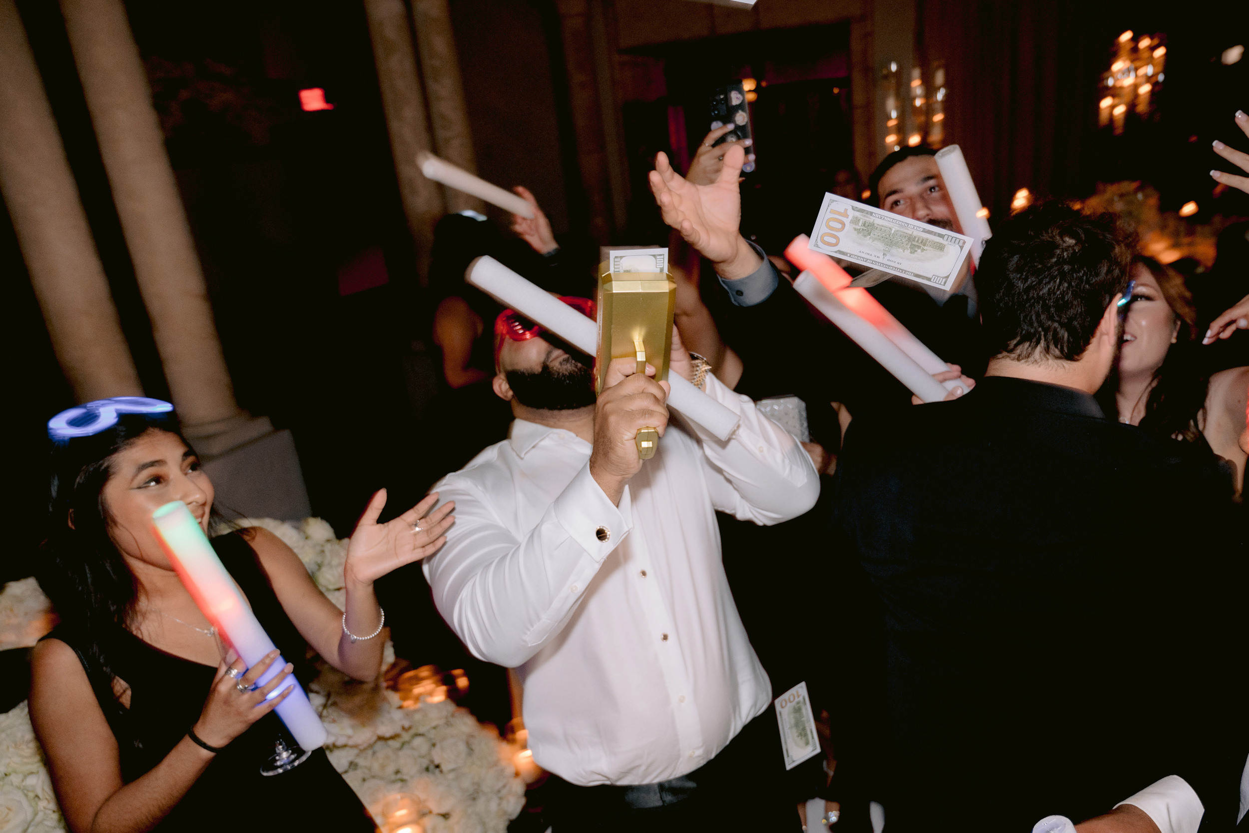 a group of people are holding up a glass