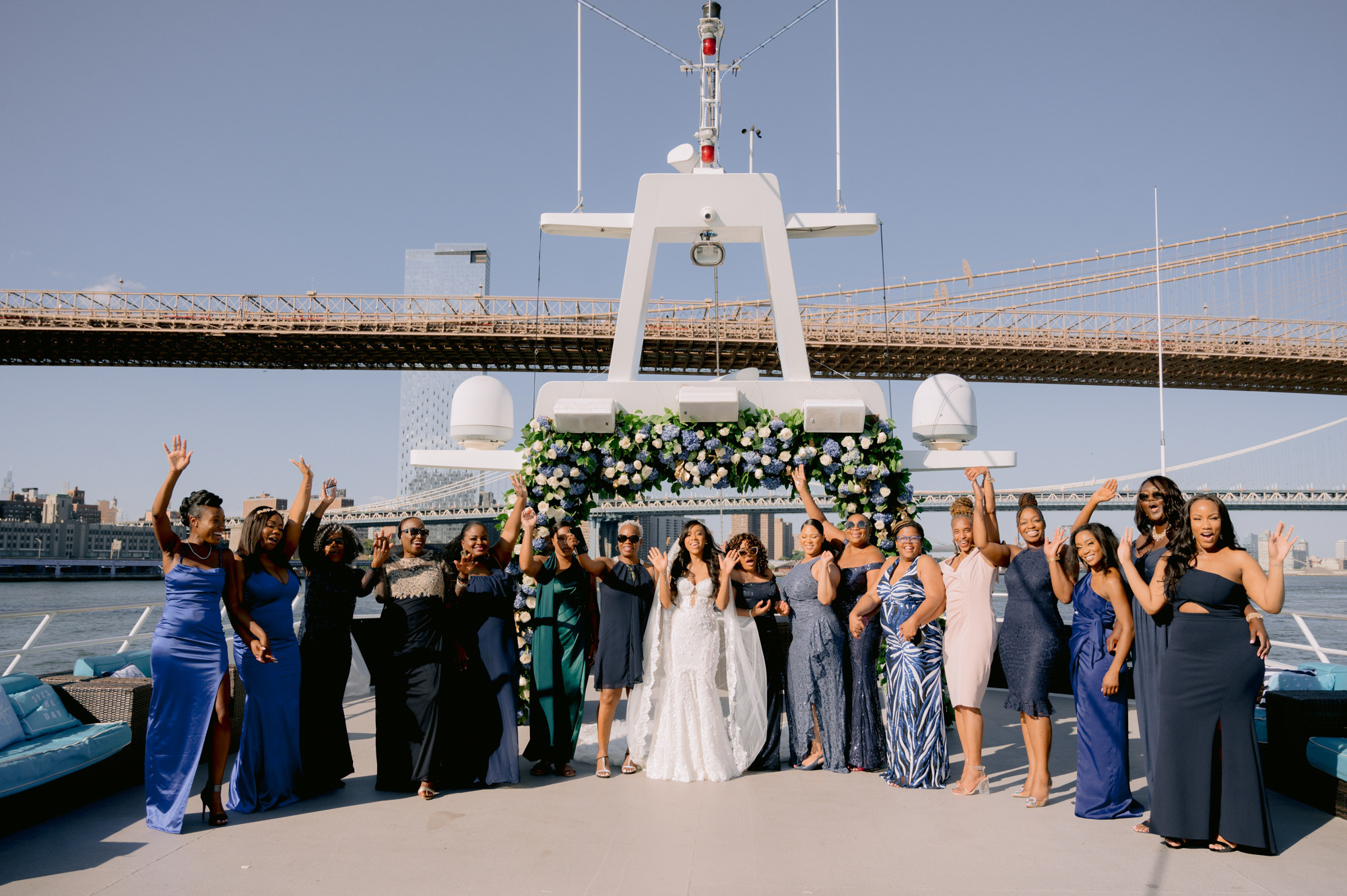 a group of women standing on a boat