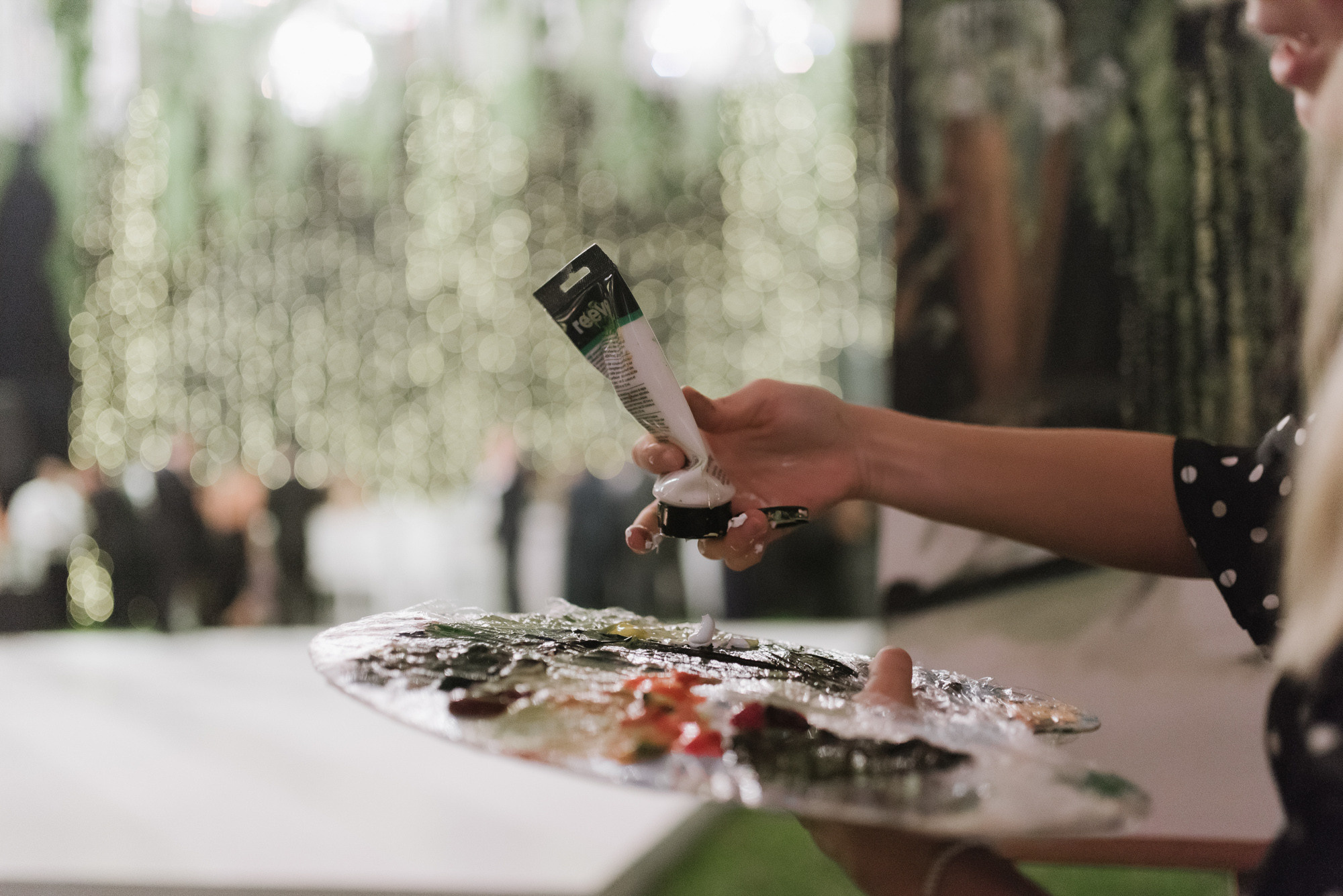 a woman holding a credit card and a knife