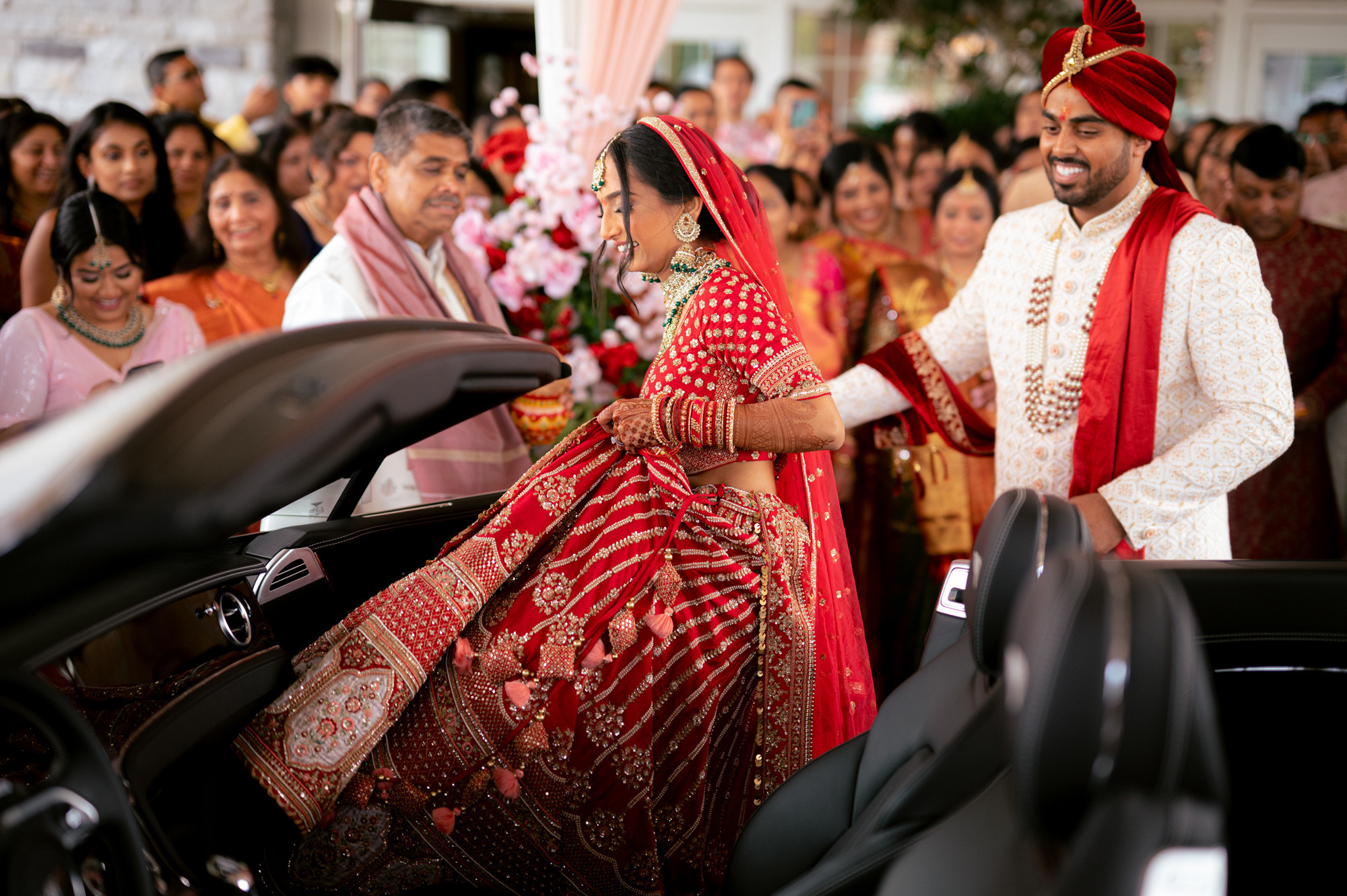 a bride and groom getting ready to get into their car