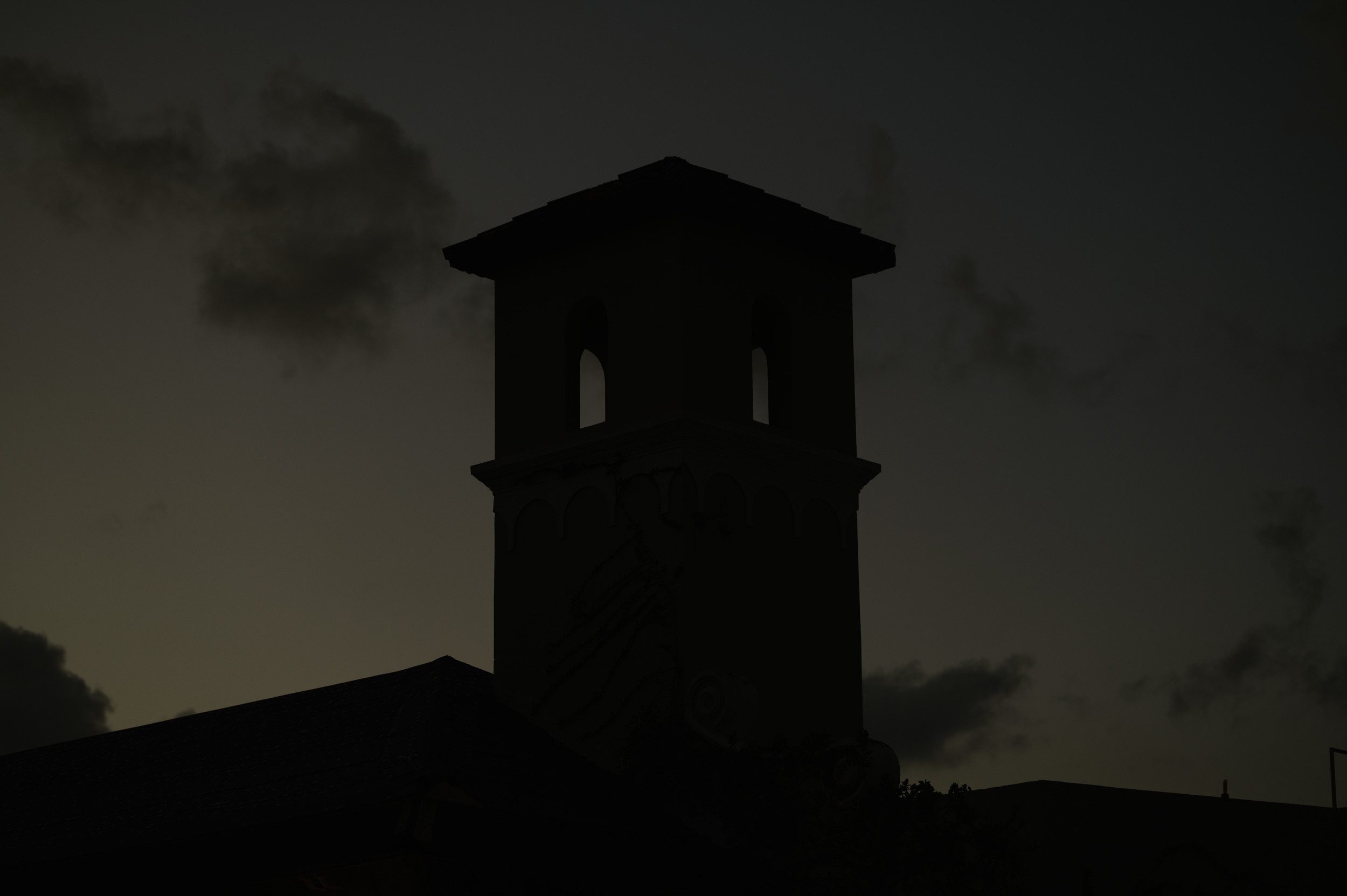 a clock tower with a clock on it's side