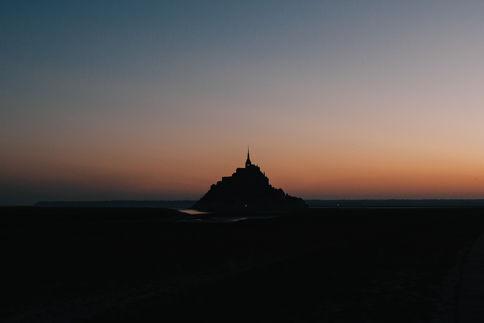 a large castle in the middle of a field