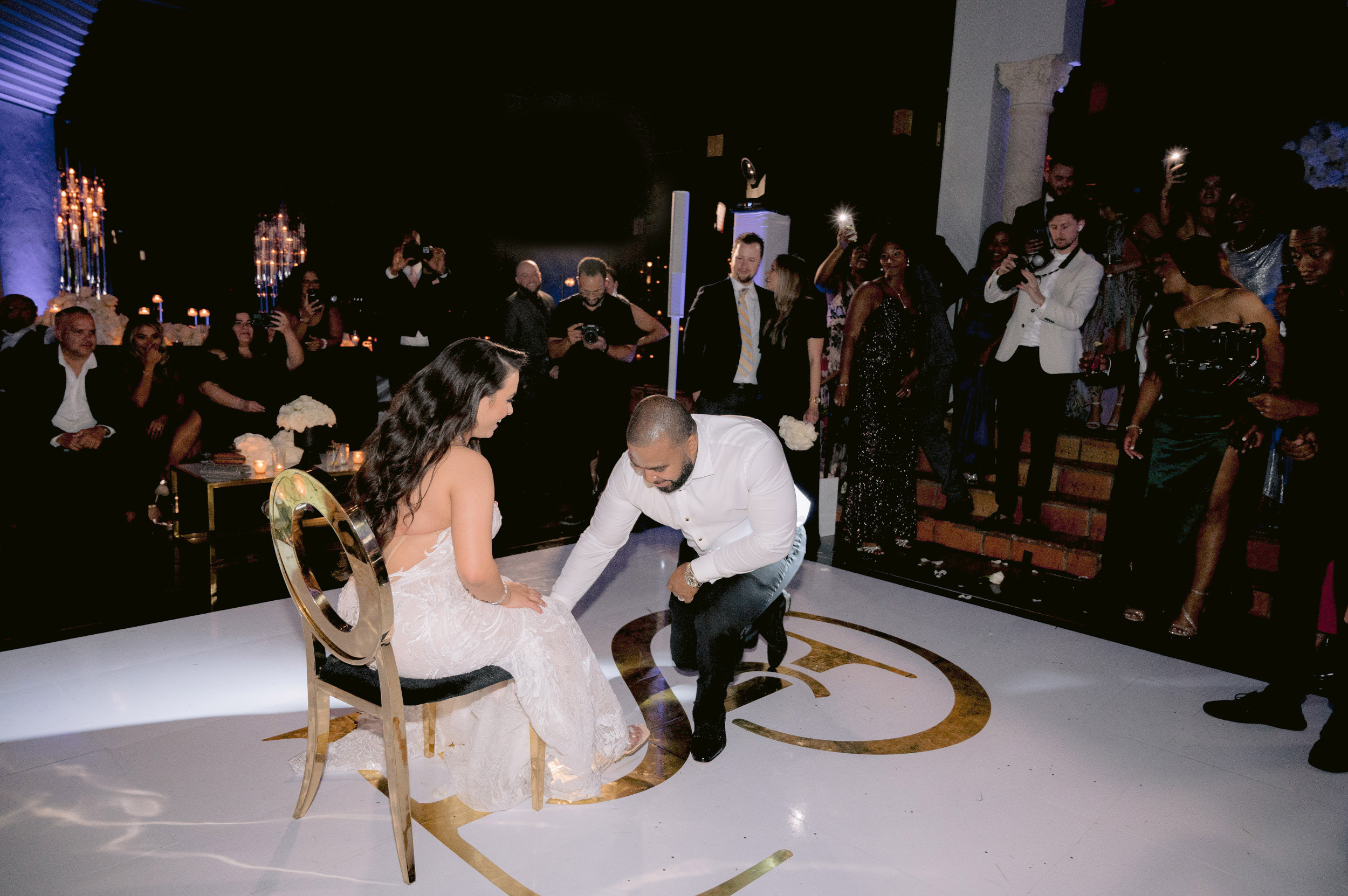 a man and woman cutting a cake together