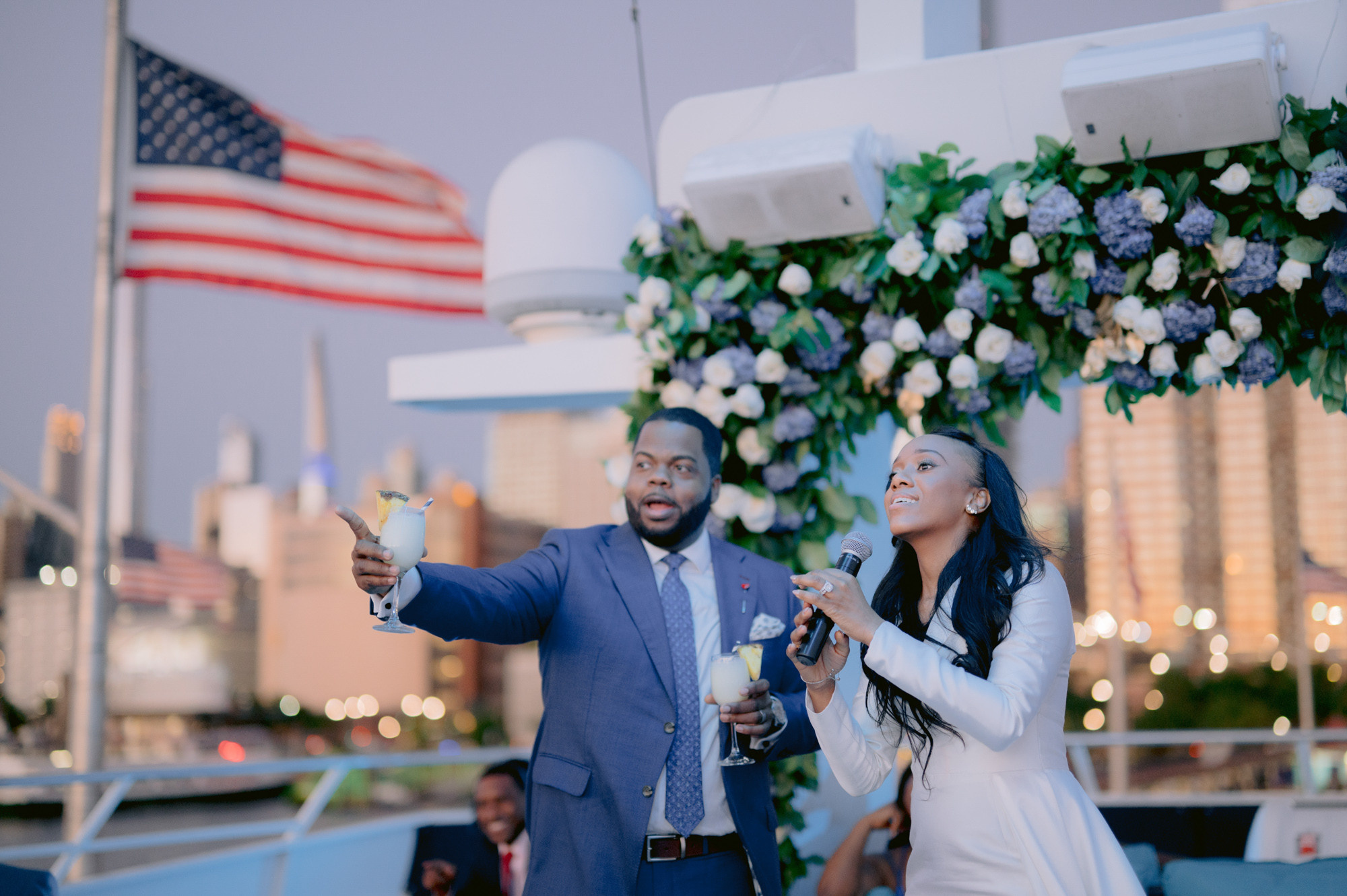 a man and woman are standing under a canopy