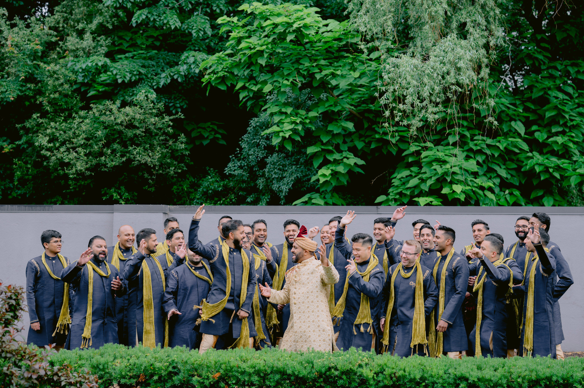 a group of people standing in front of a wall