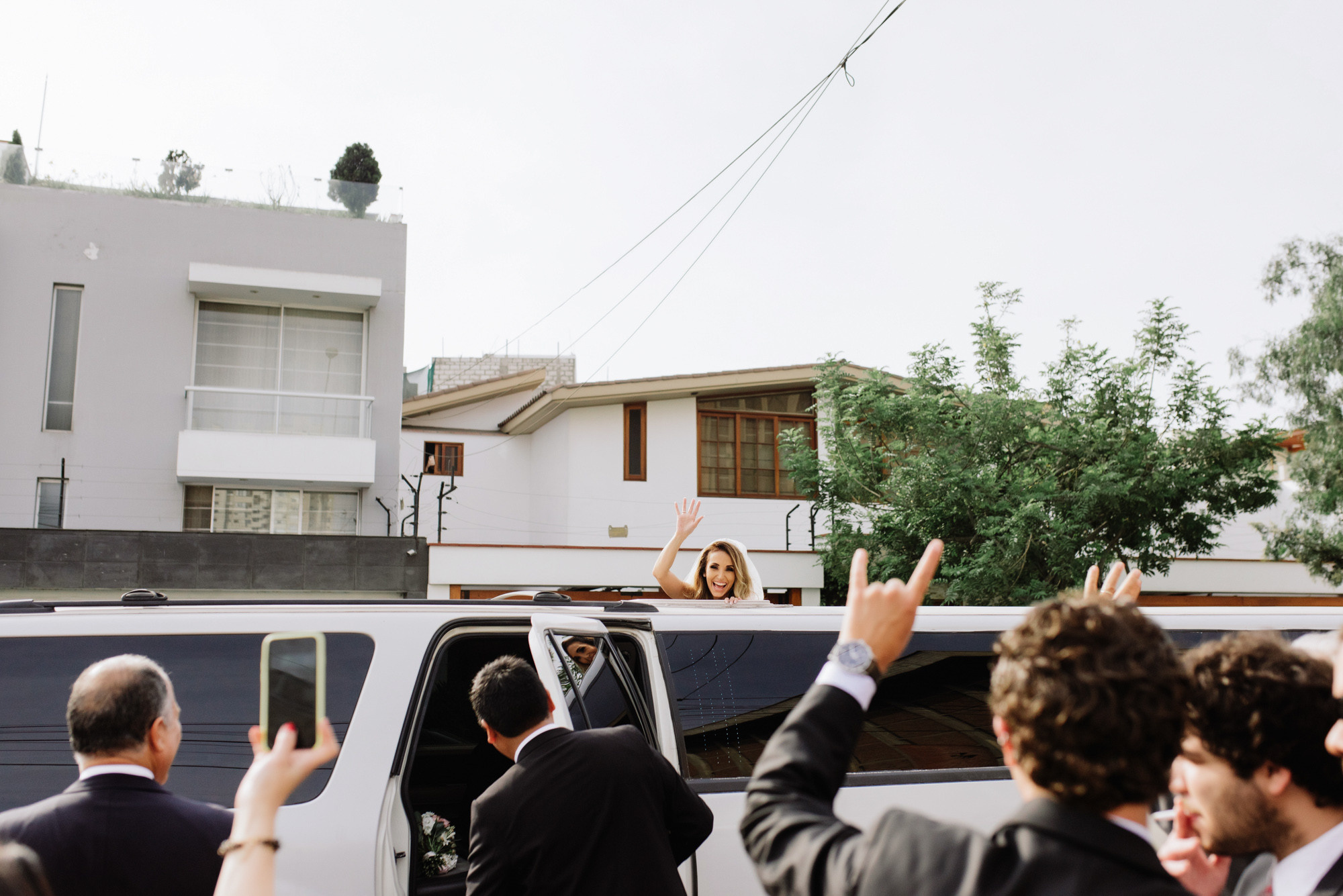 a group of people standing in front of a white van