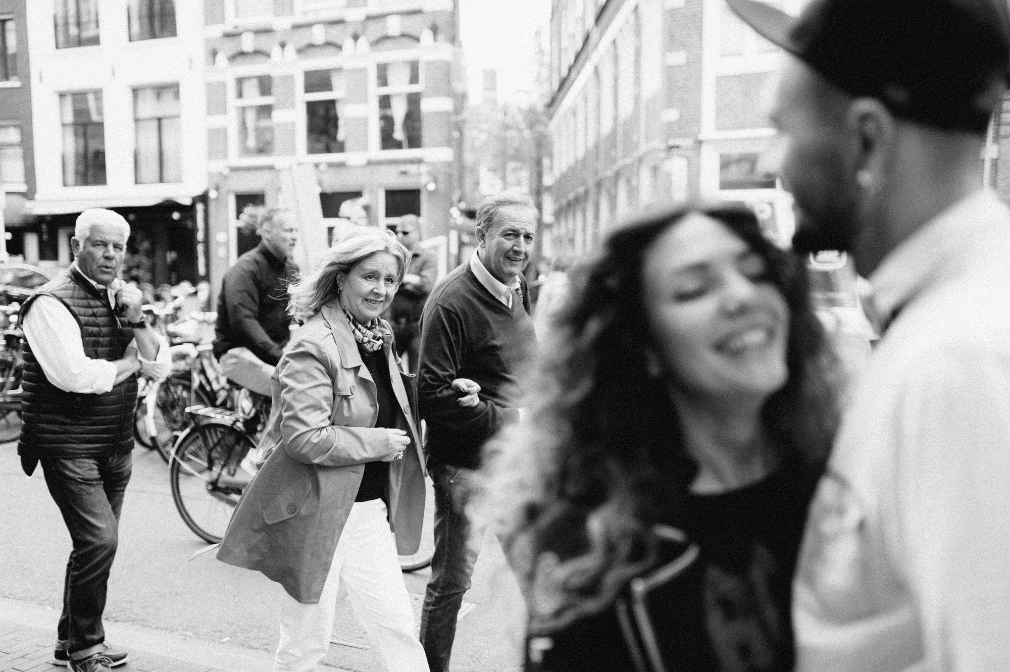 a group of people walking down a street
