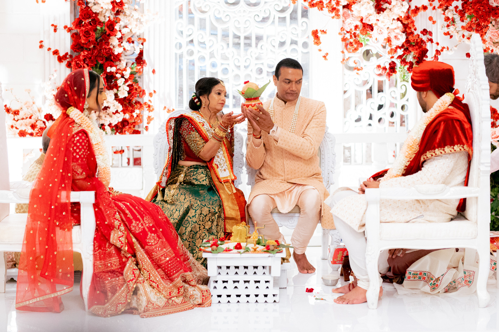 a man and woman sitting on a white chair