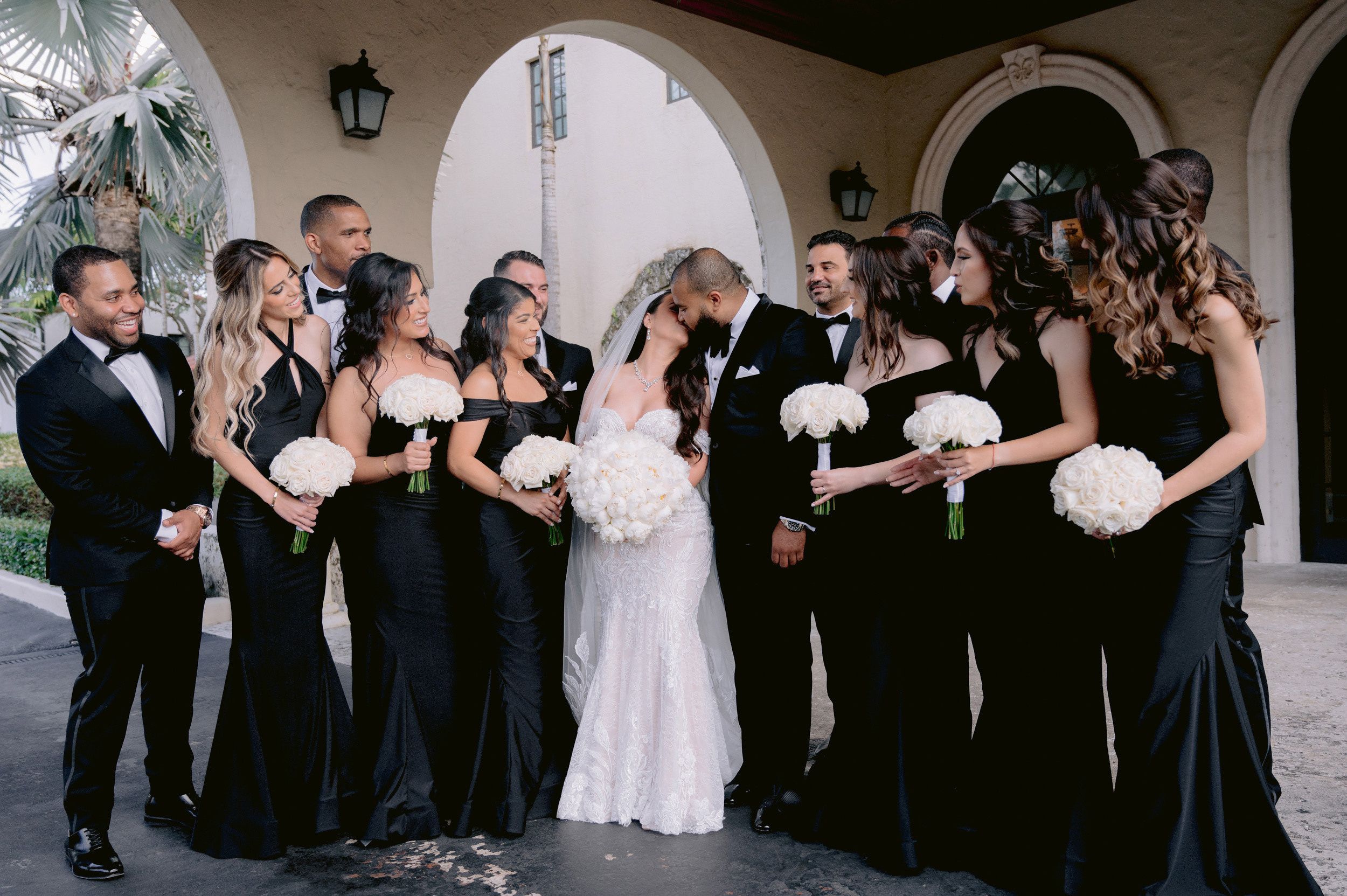 a group of people standing around each other people