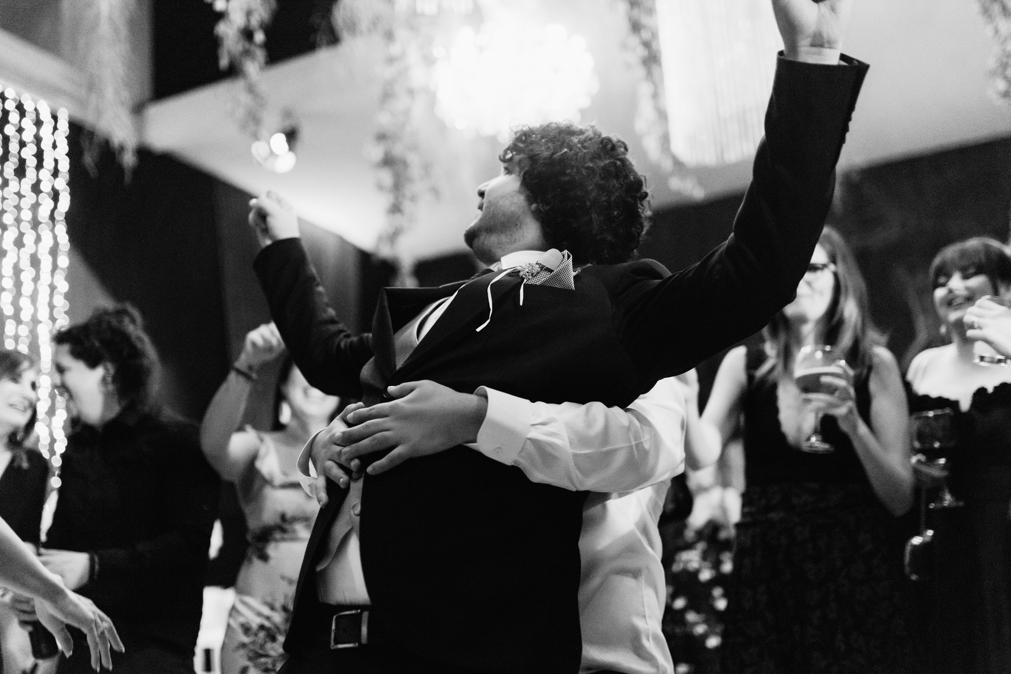 a man and woman dancing at a wedding