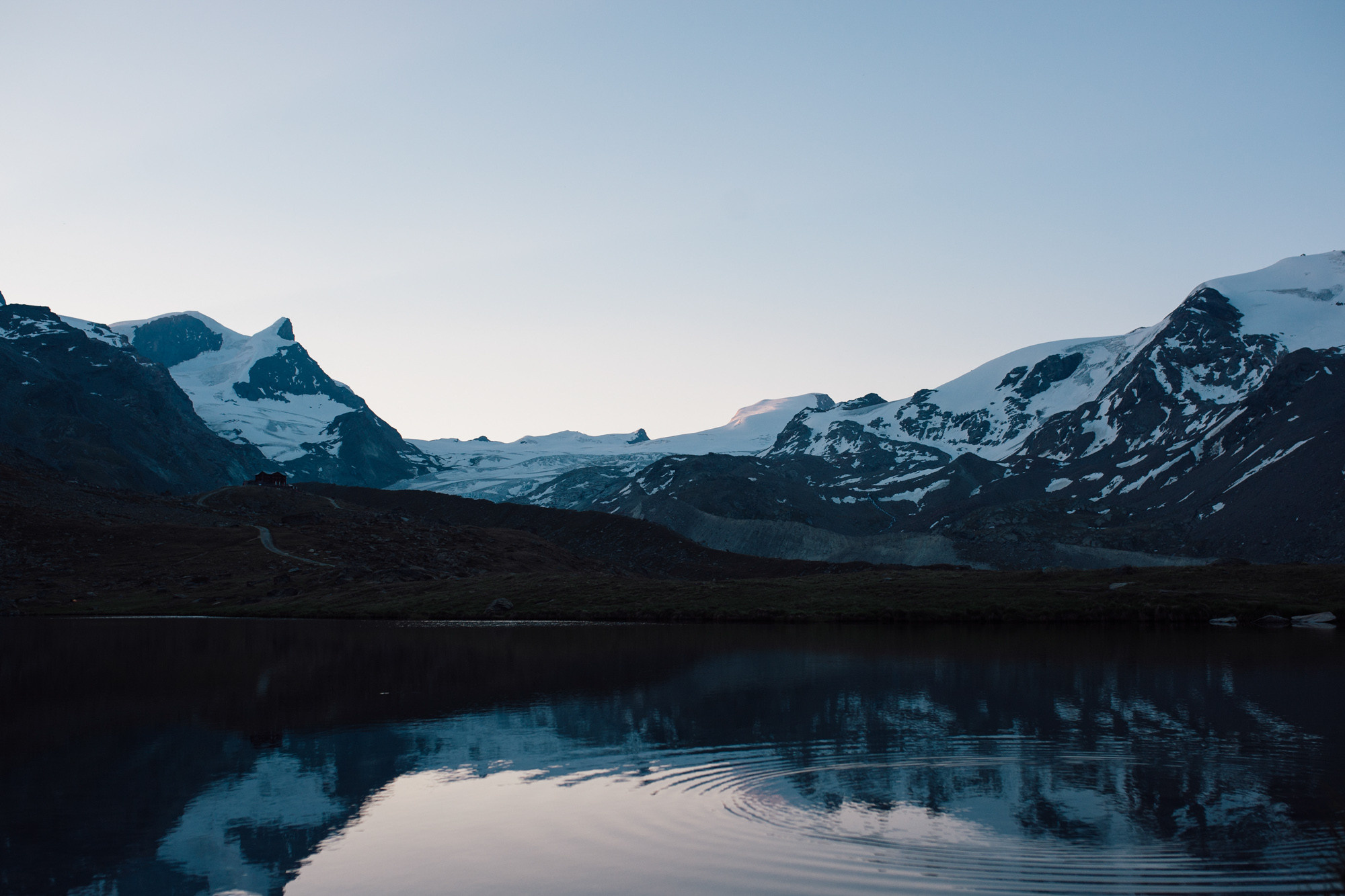 a mountain range reflected in a lake