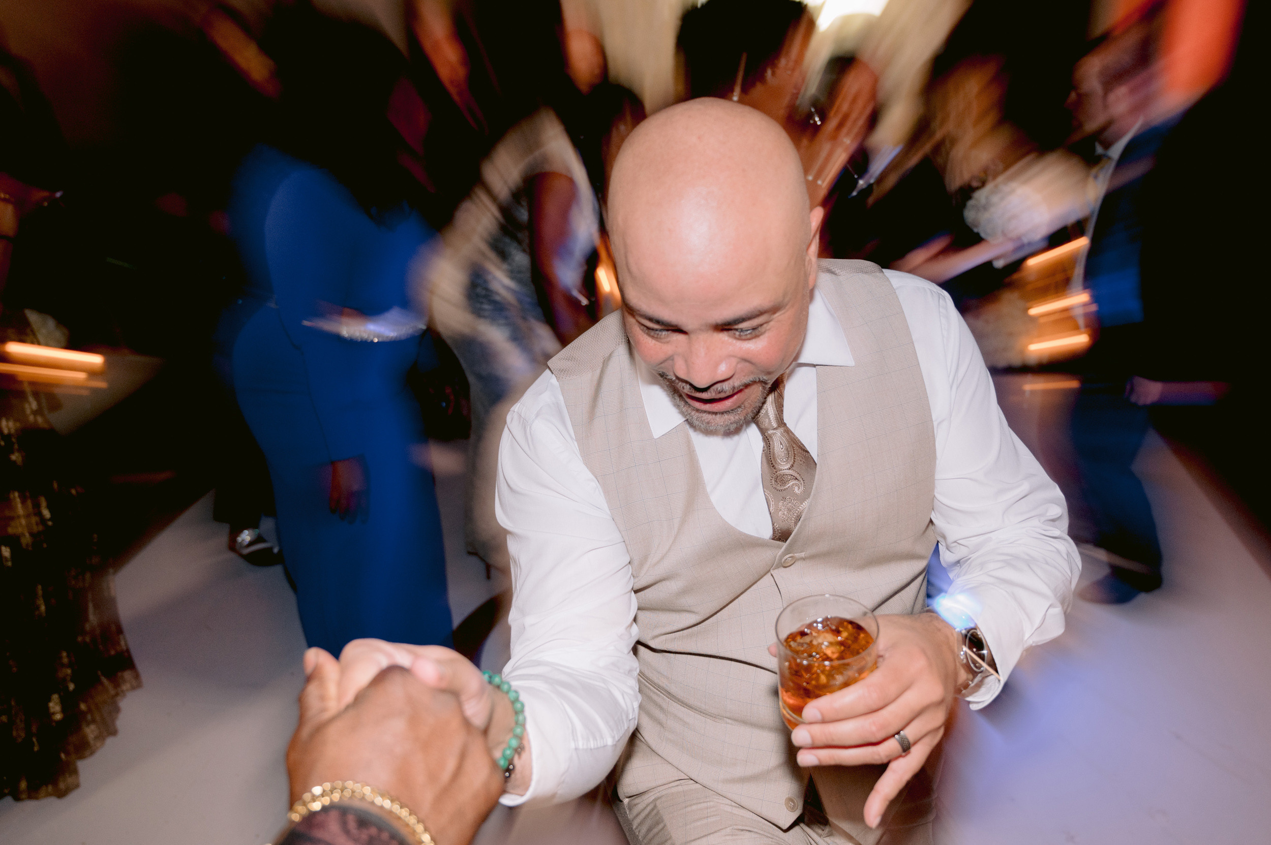 a man in a suit is holding a dont