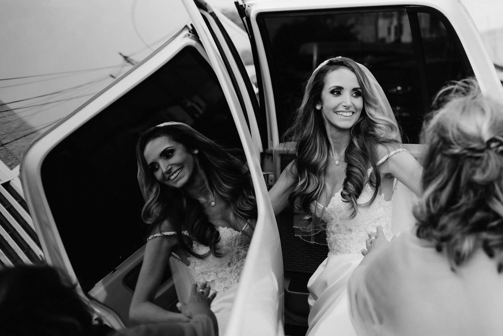 bride getting into the limo