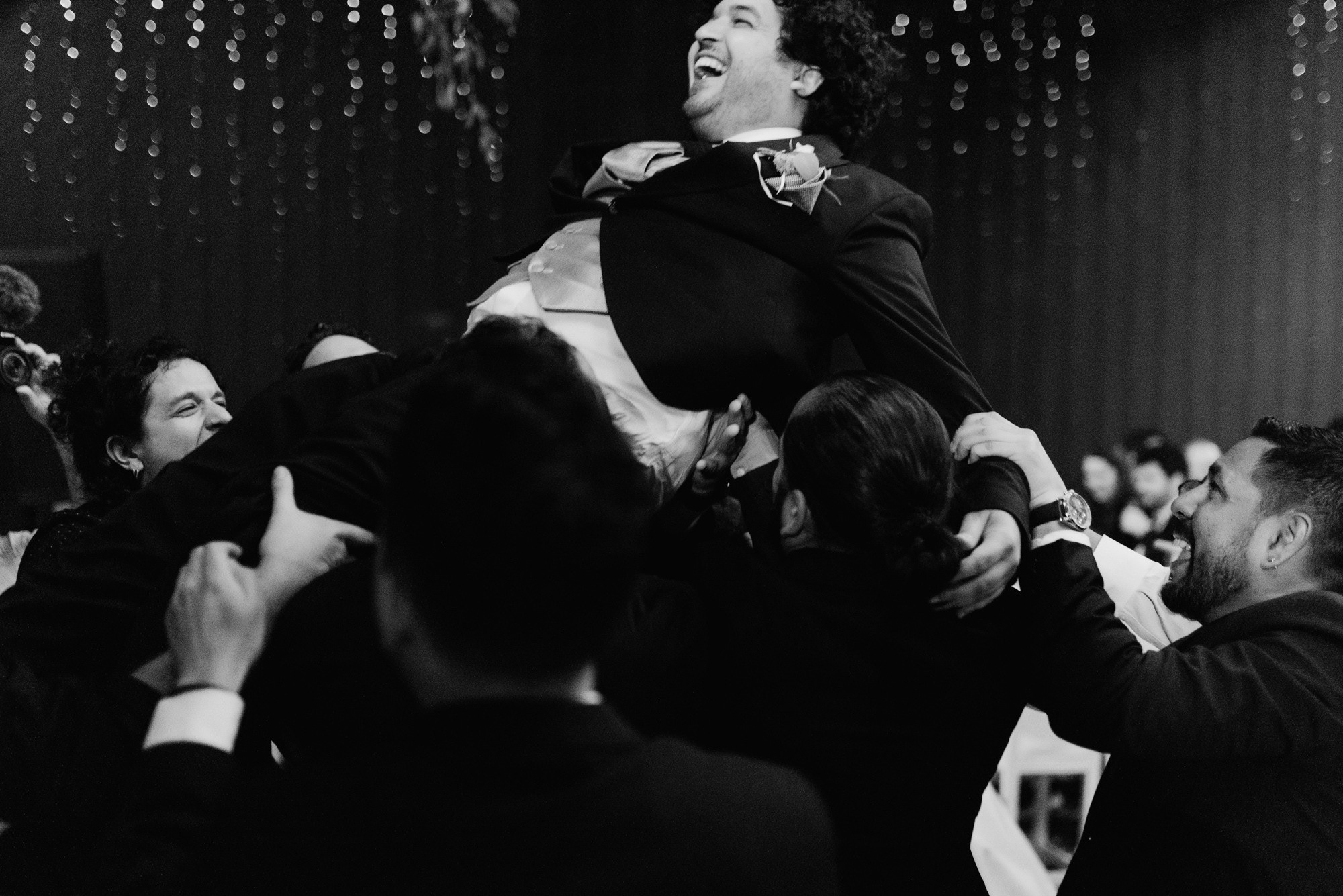 a man is holding a woman in his arms