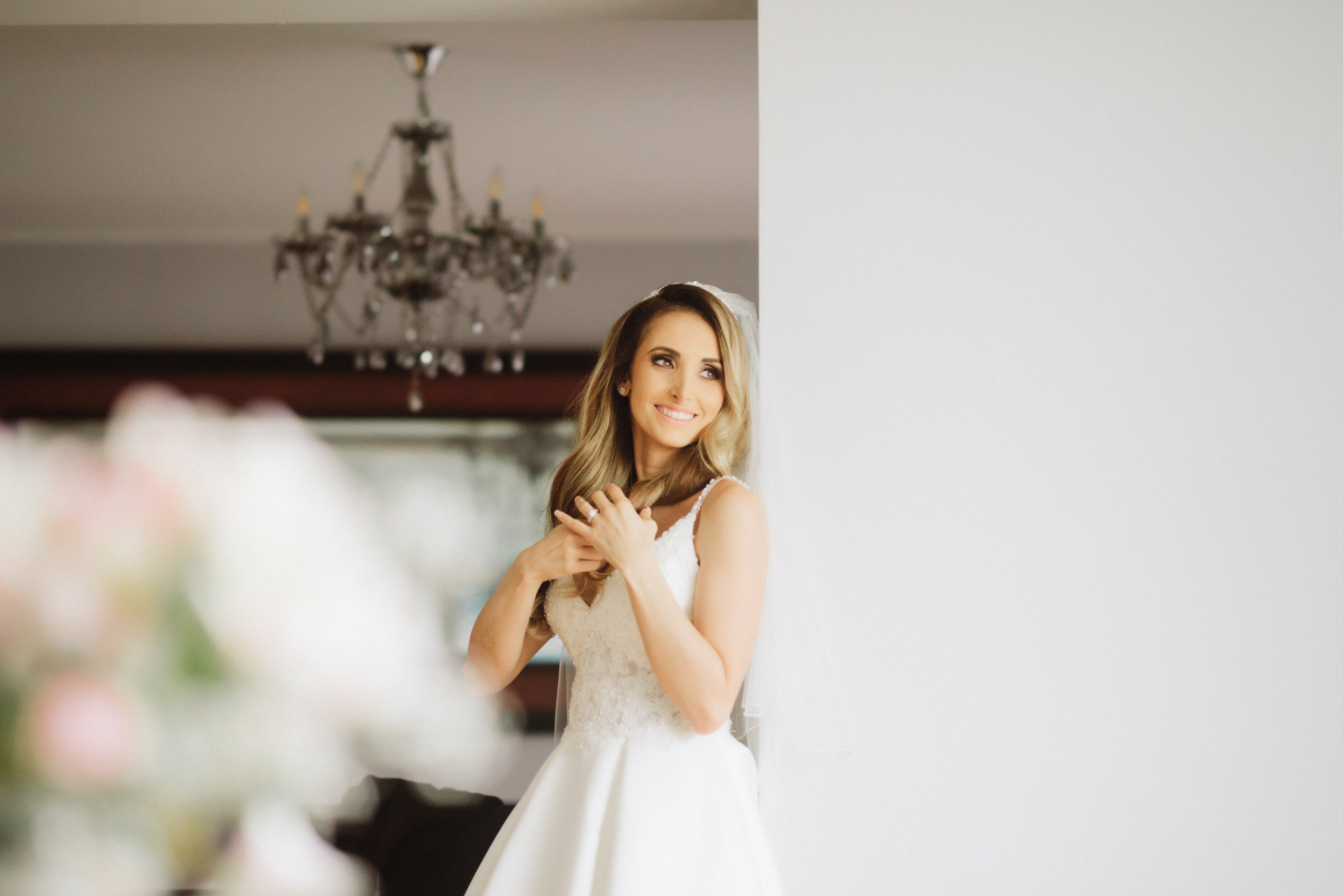 a bride in her wedding dress looking at her phone