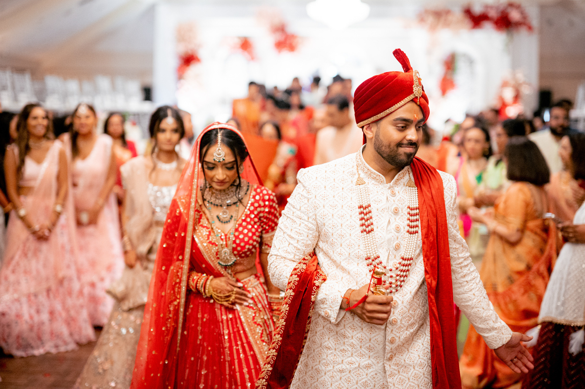 a man and woman walking down a hall