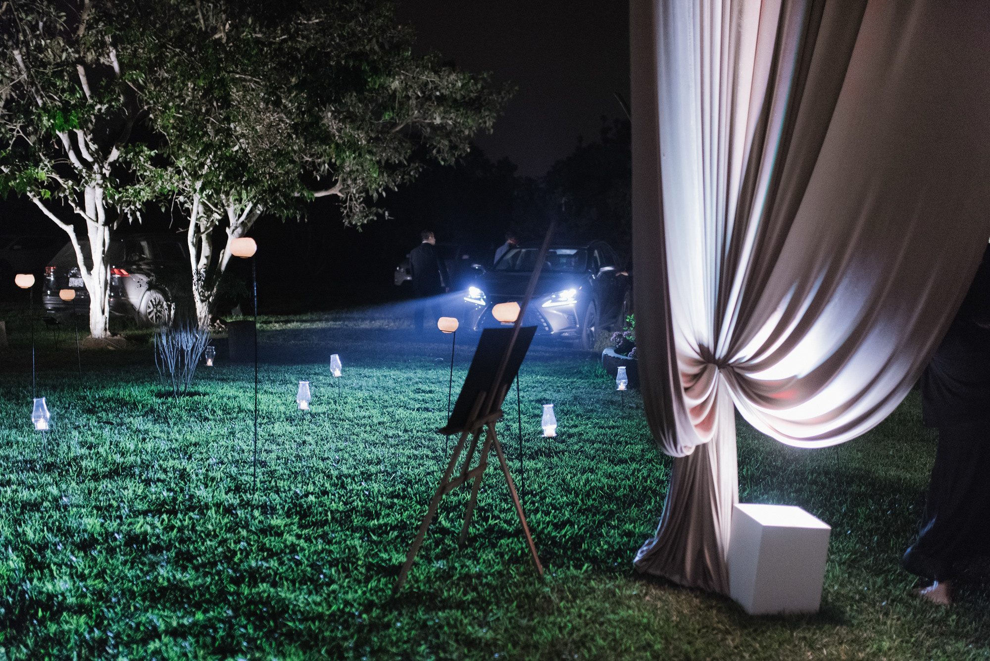 a couple of people standing in a field