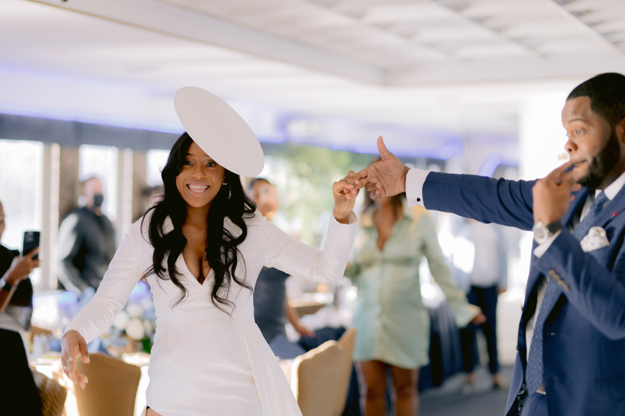 a man and woman dancing in a room
