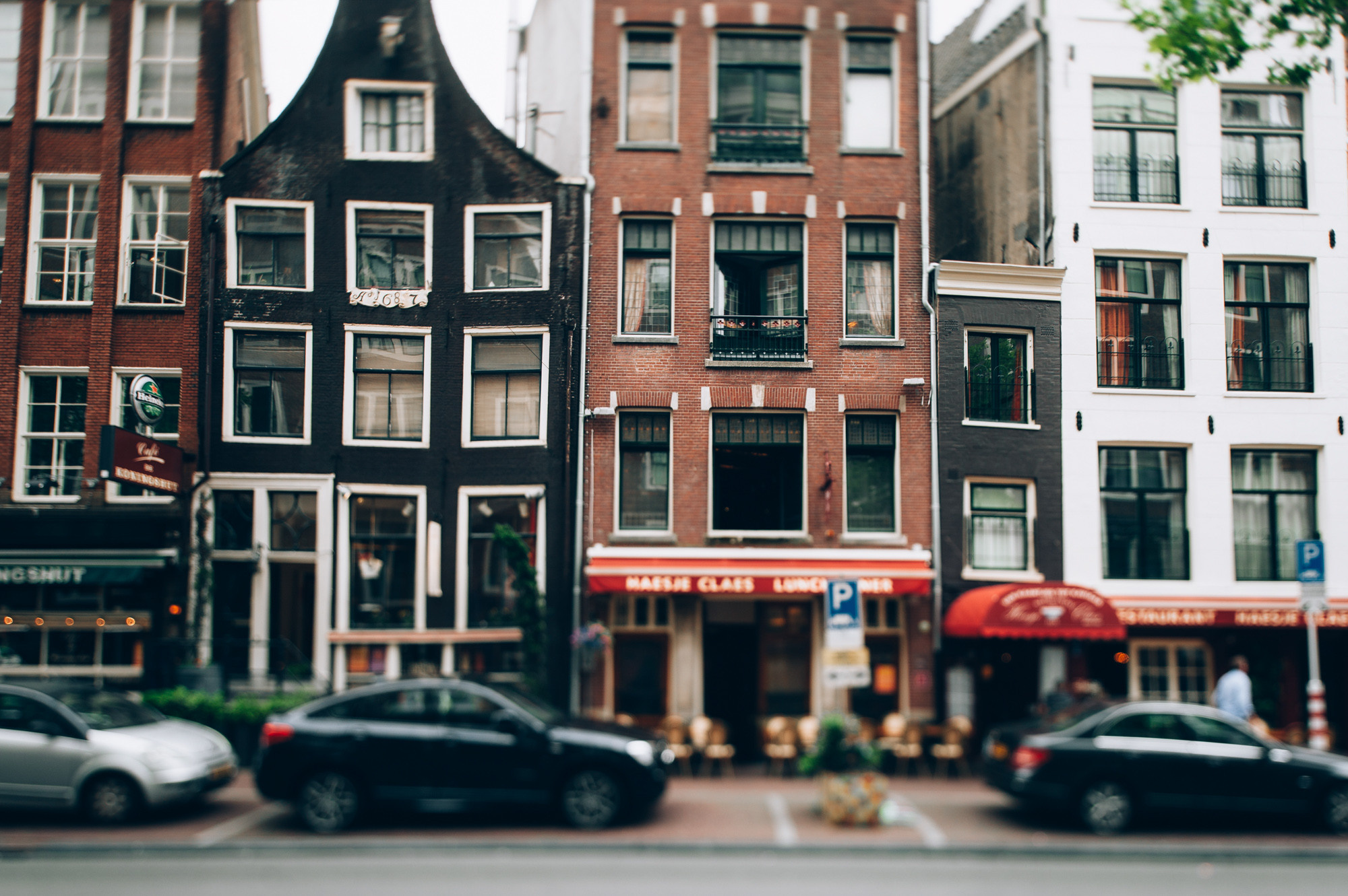 a street scene with a row of buildings