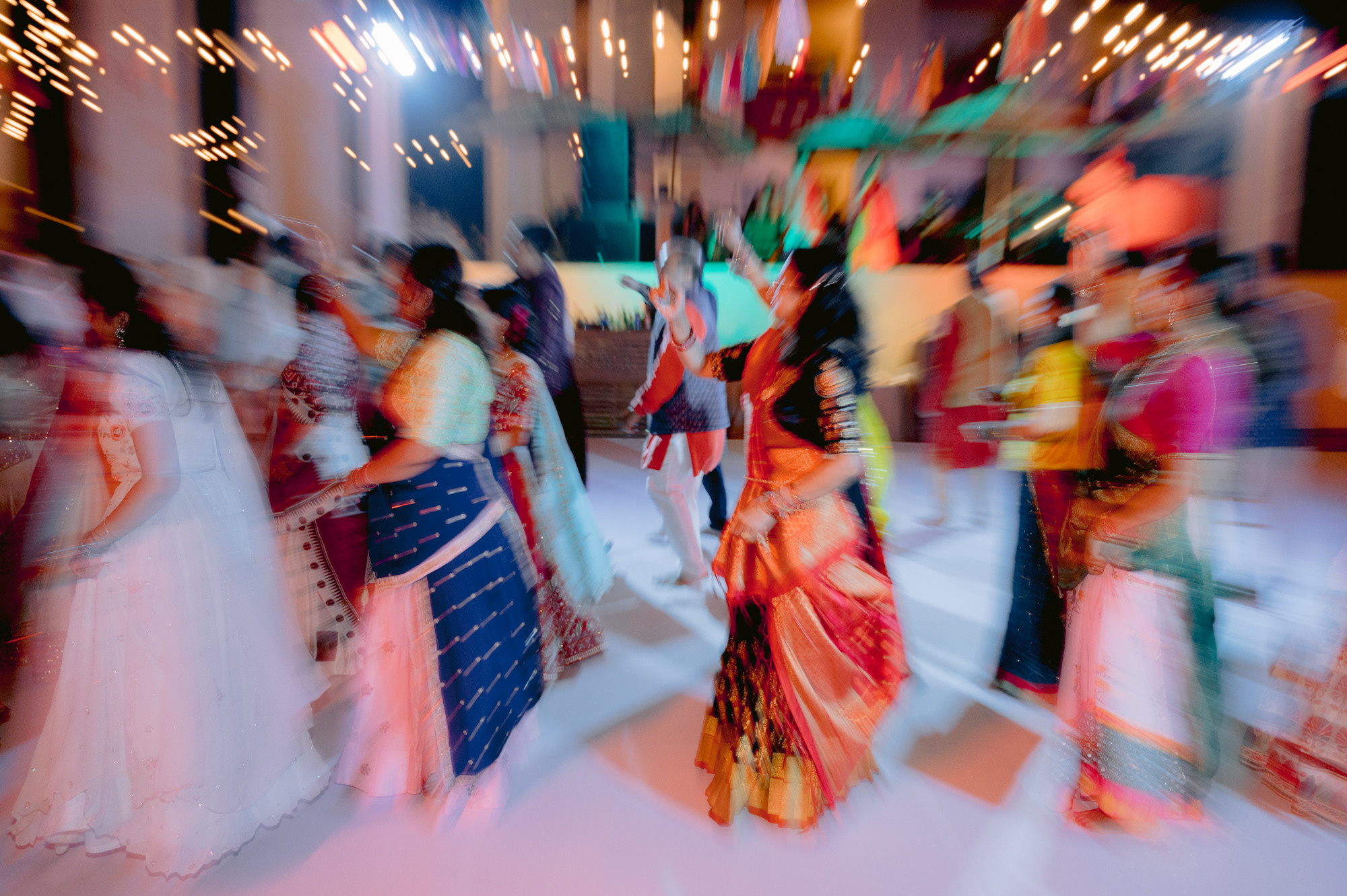 a group of people dancing in a room