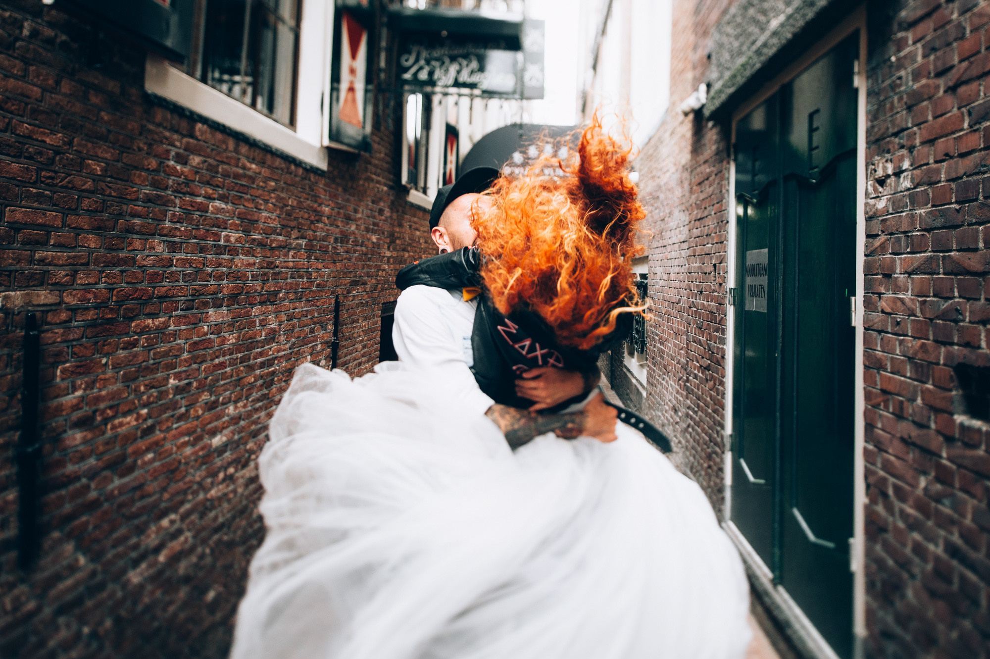 a woman with a red hair and a white dress
