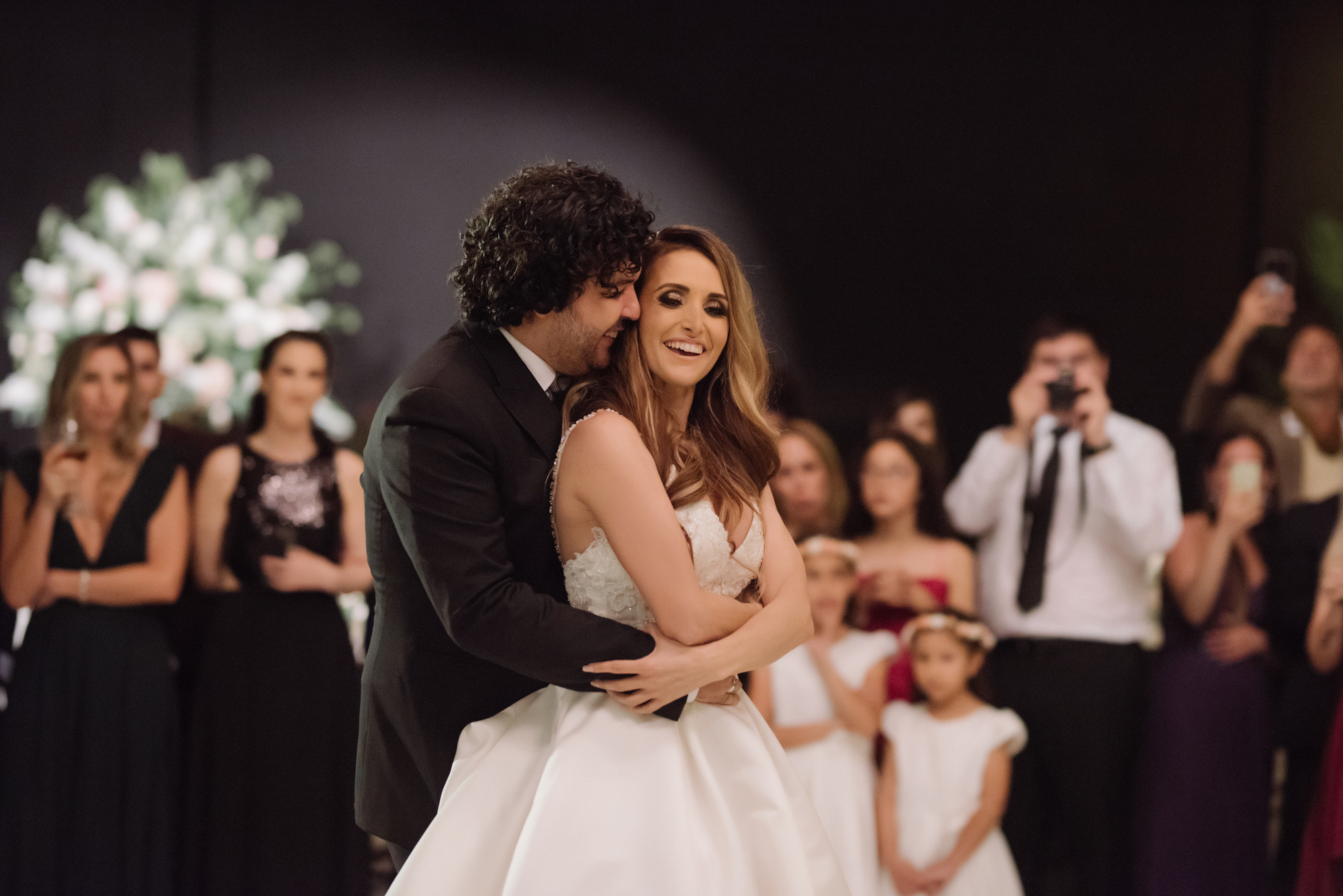 a bride and groom sharing their first dance