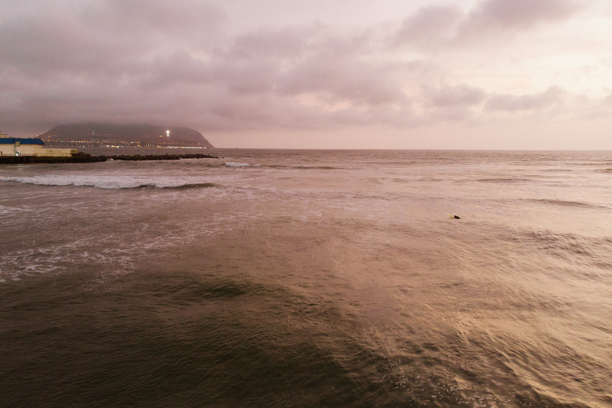 a person is surfing in the ocean