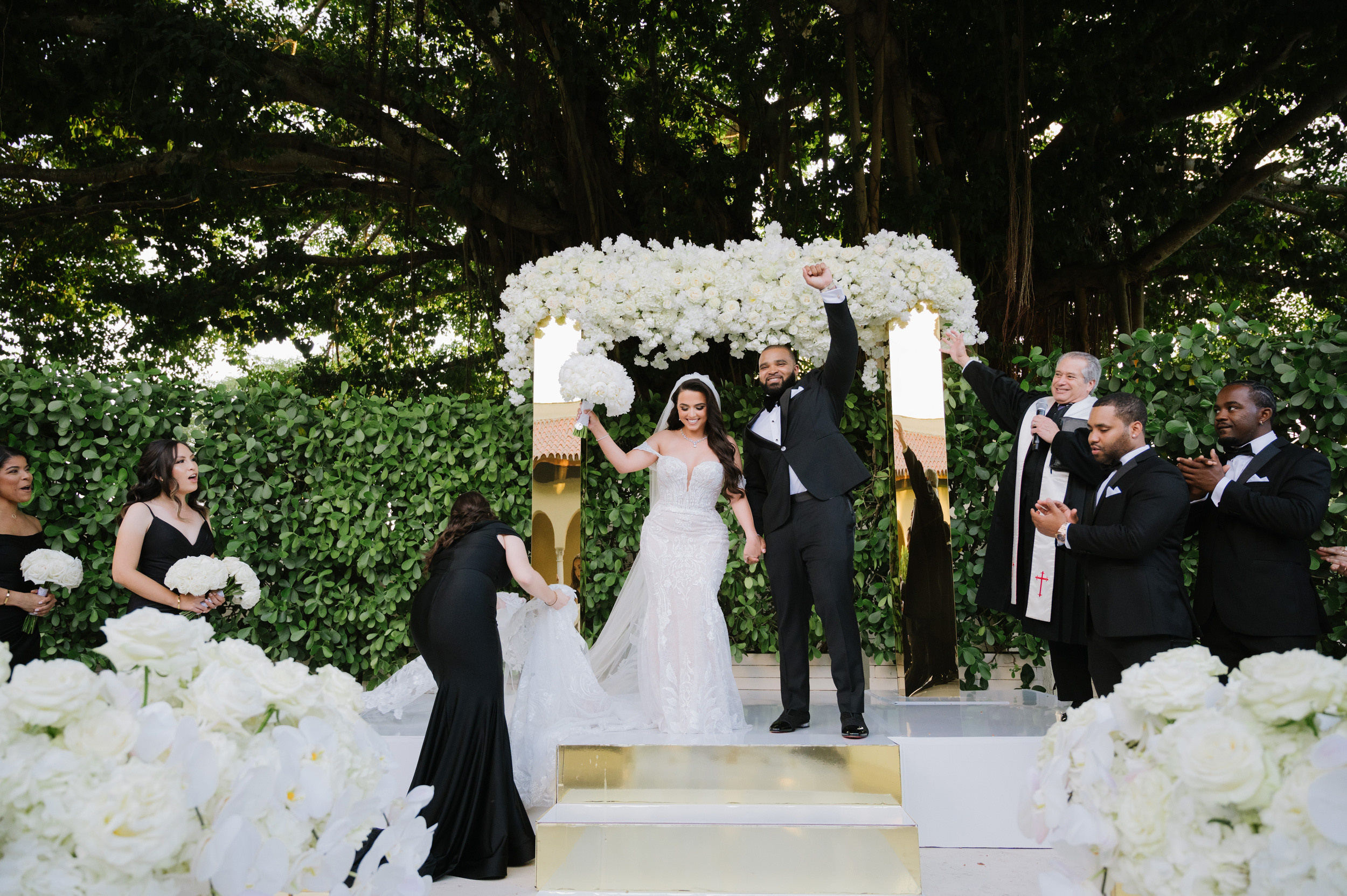 a bride and groom walking down the aisle