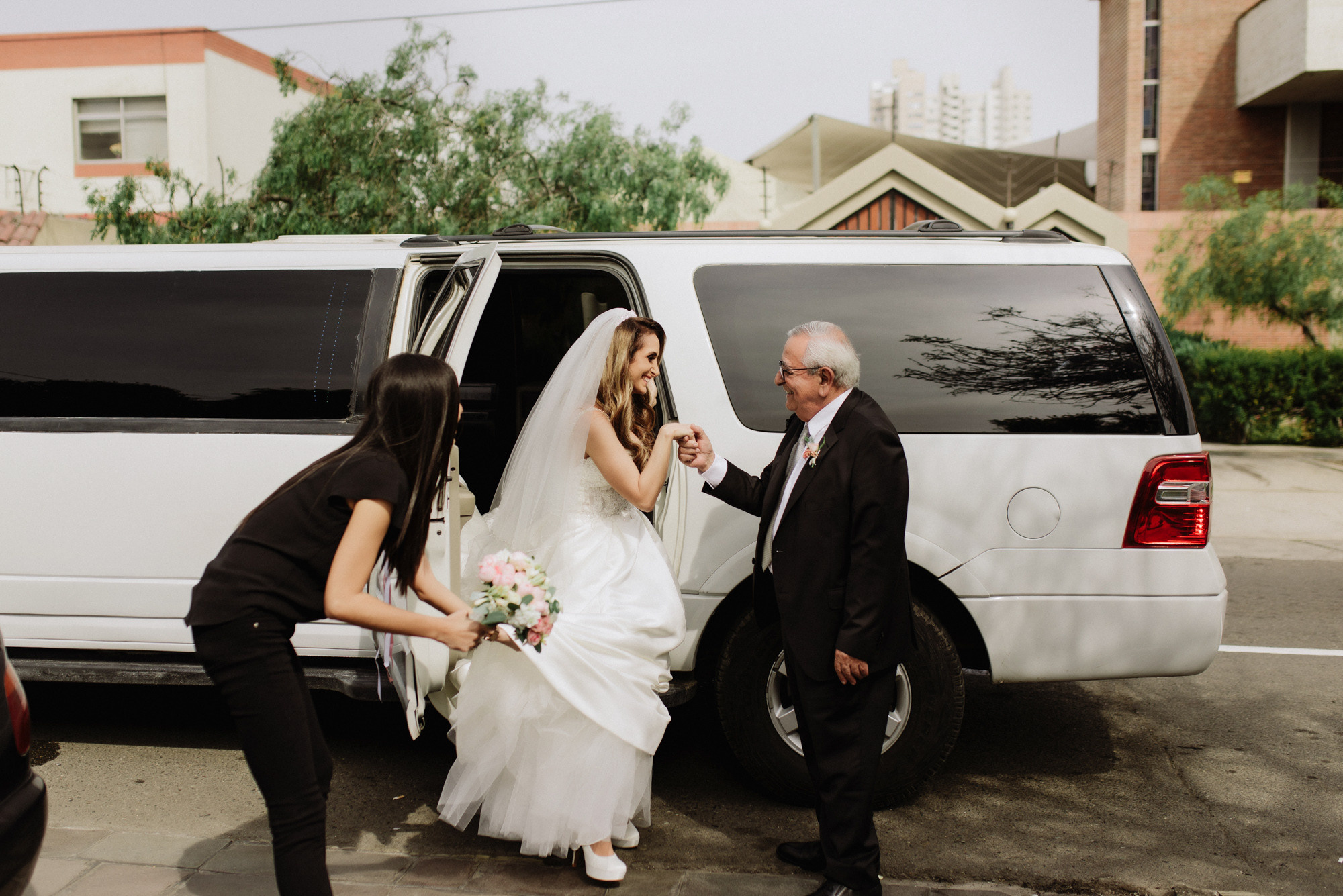 a bride getting into a white van