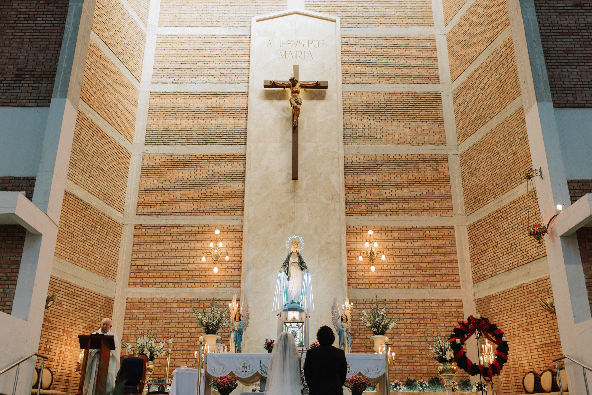 a couple of people standing in a church