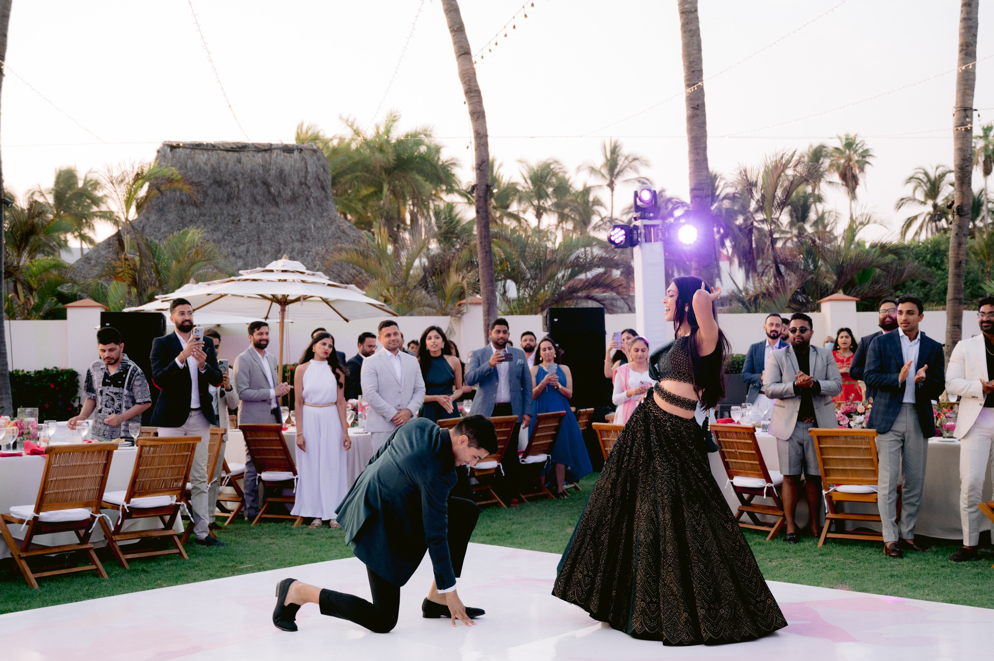 a man and woman dancing on a dance floor