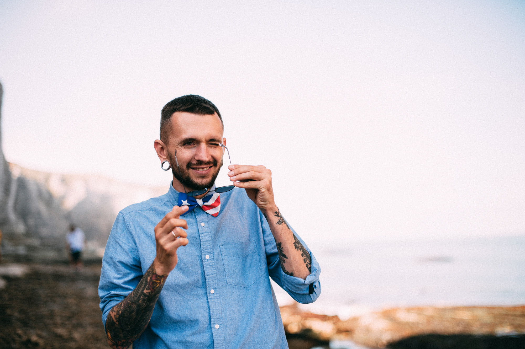 a man with a beard and a blue shirt