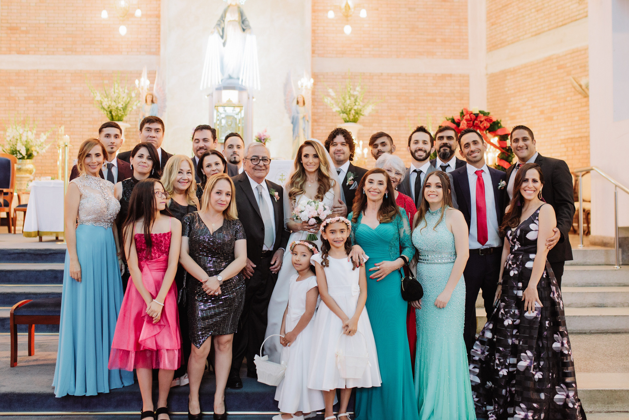a group of people posing for a photo in front of a church