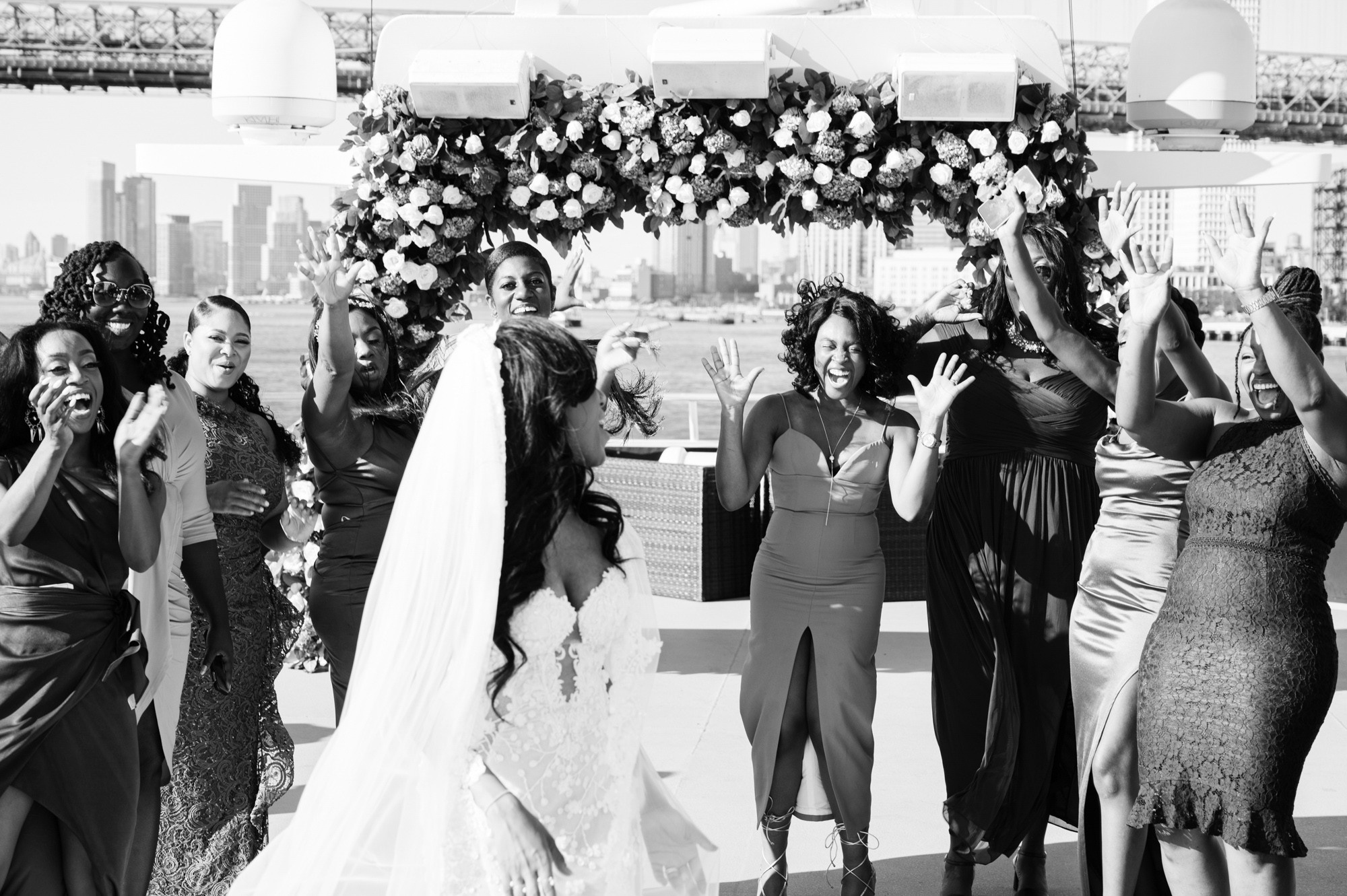 a group of people standing around a bride