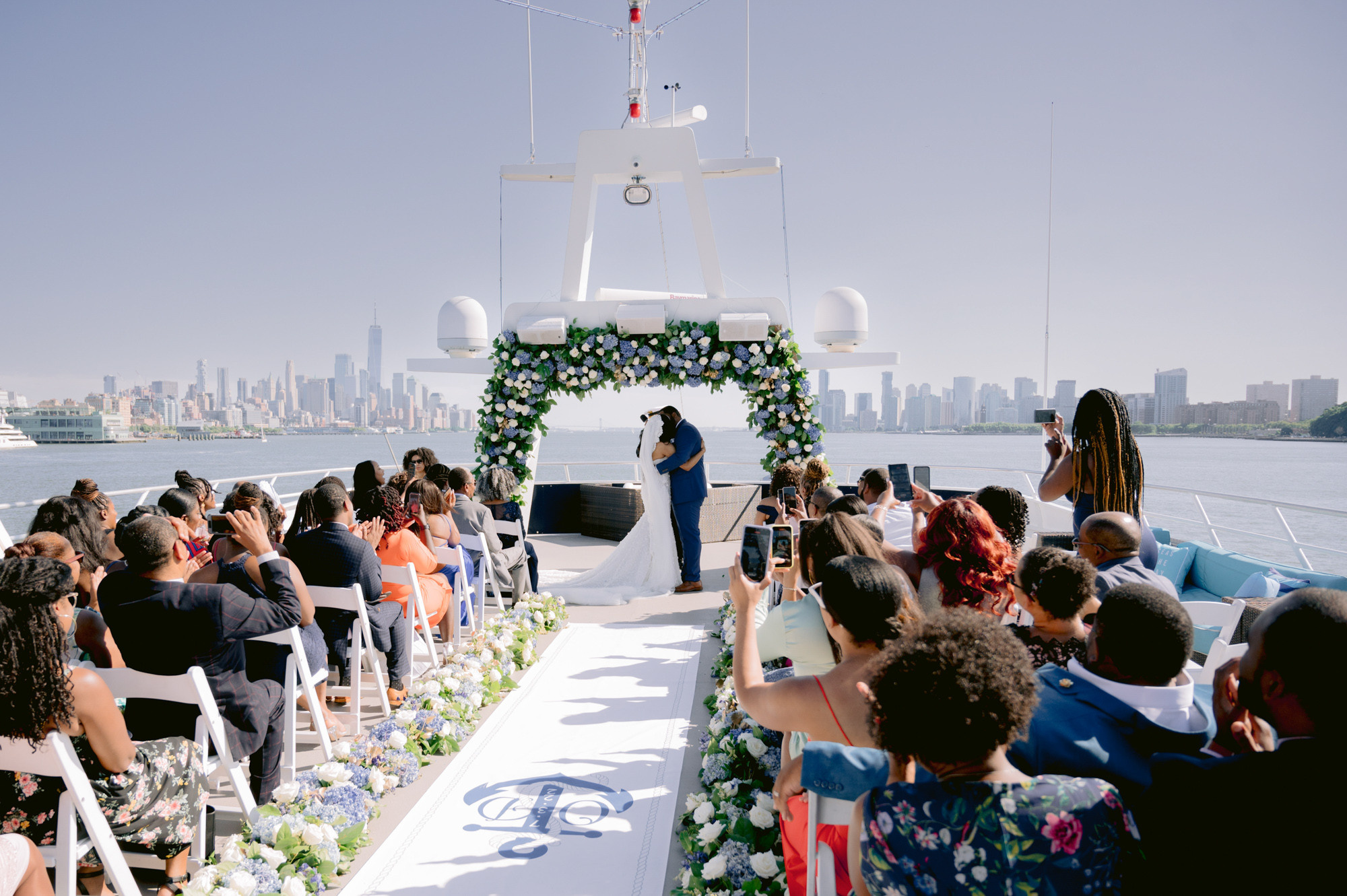 a wedding ceremony on the deck of a boat