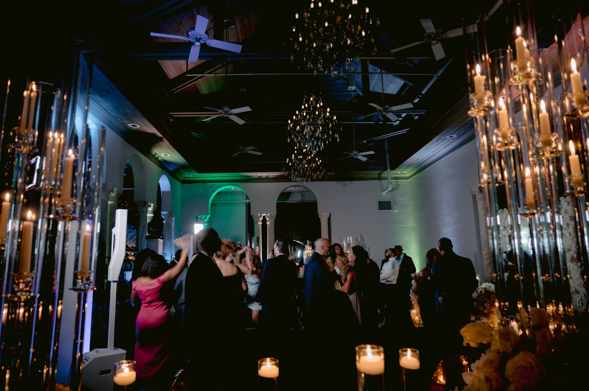 a group of people standing around a room