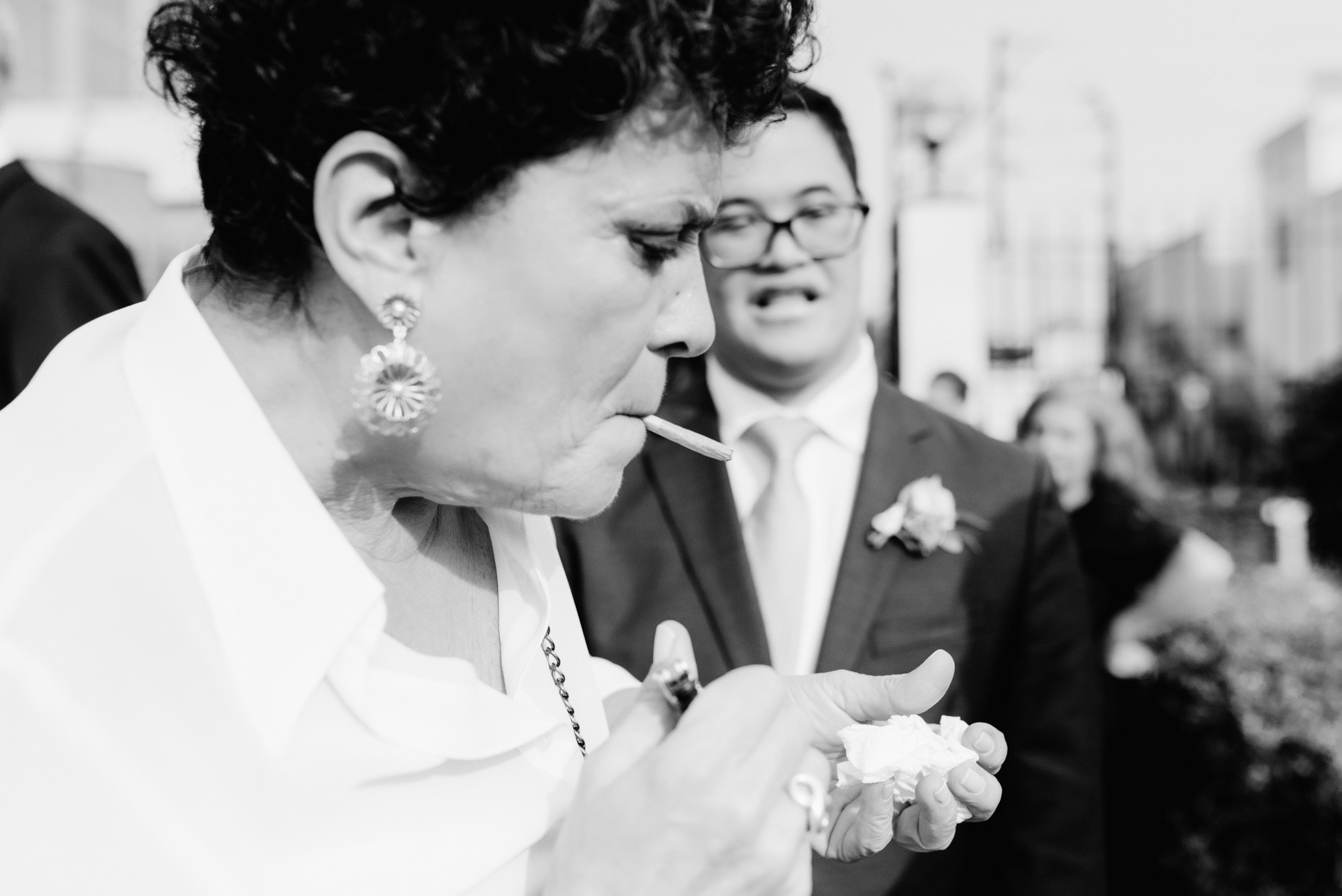 a woman in a white jacket and a man in a suit