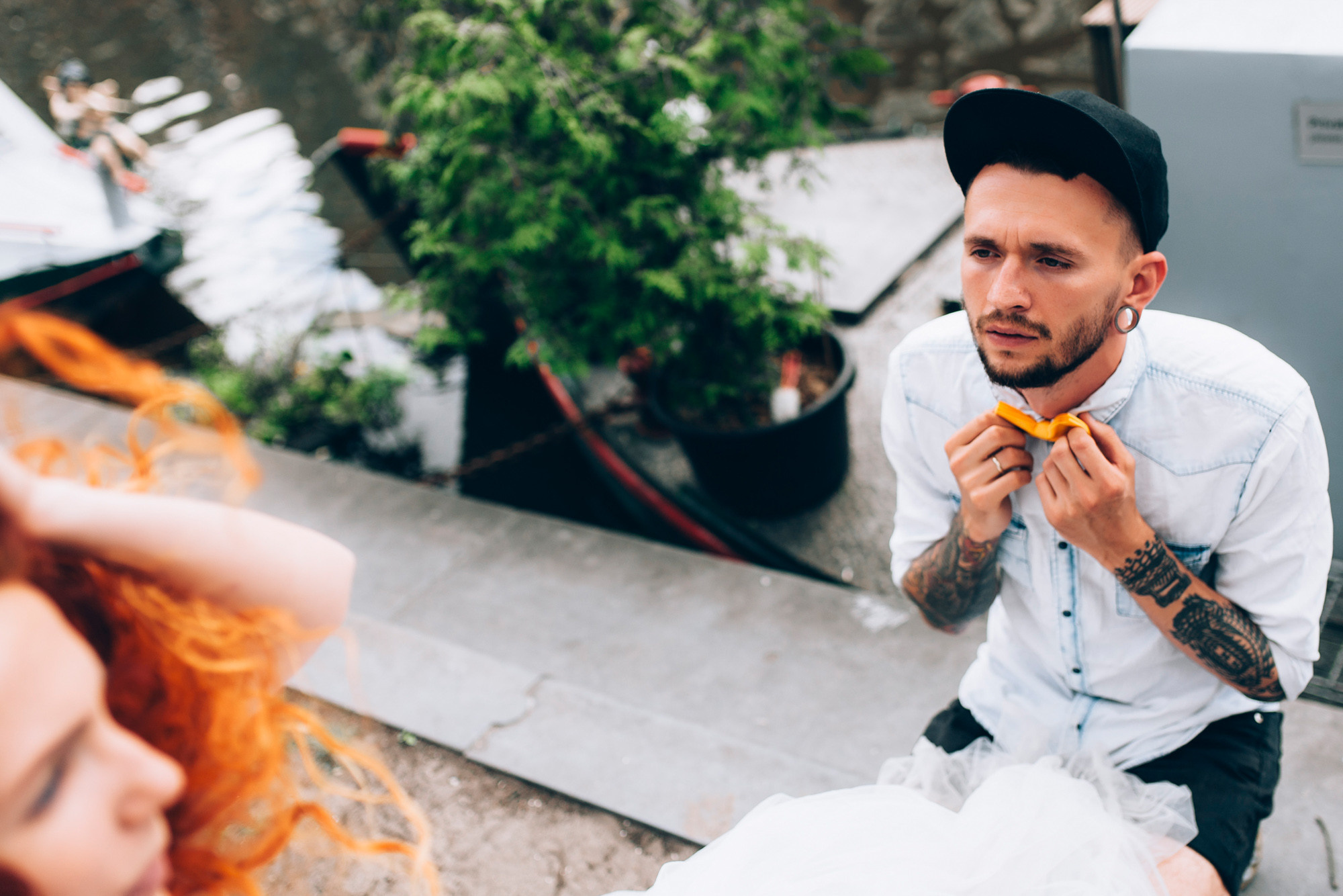 a man and woman sitting on the ground