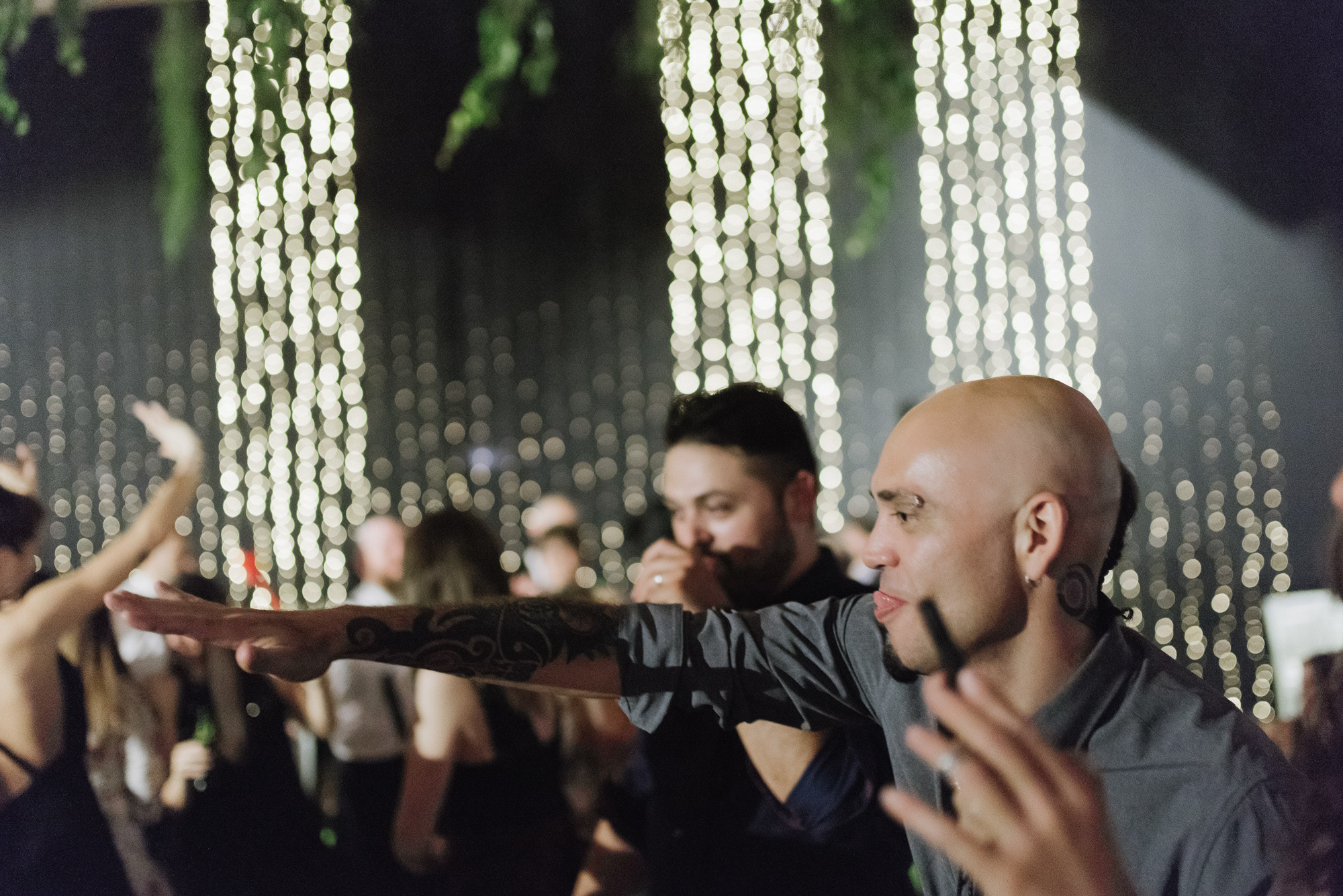 a man is dancing with a crowd of people