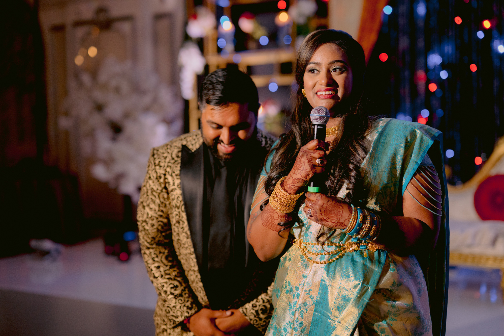 a man and woman standing next to each other people