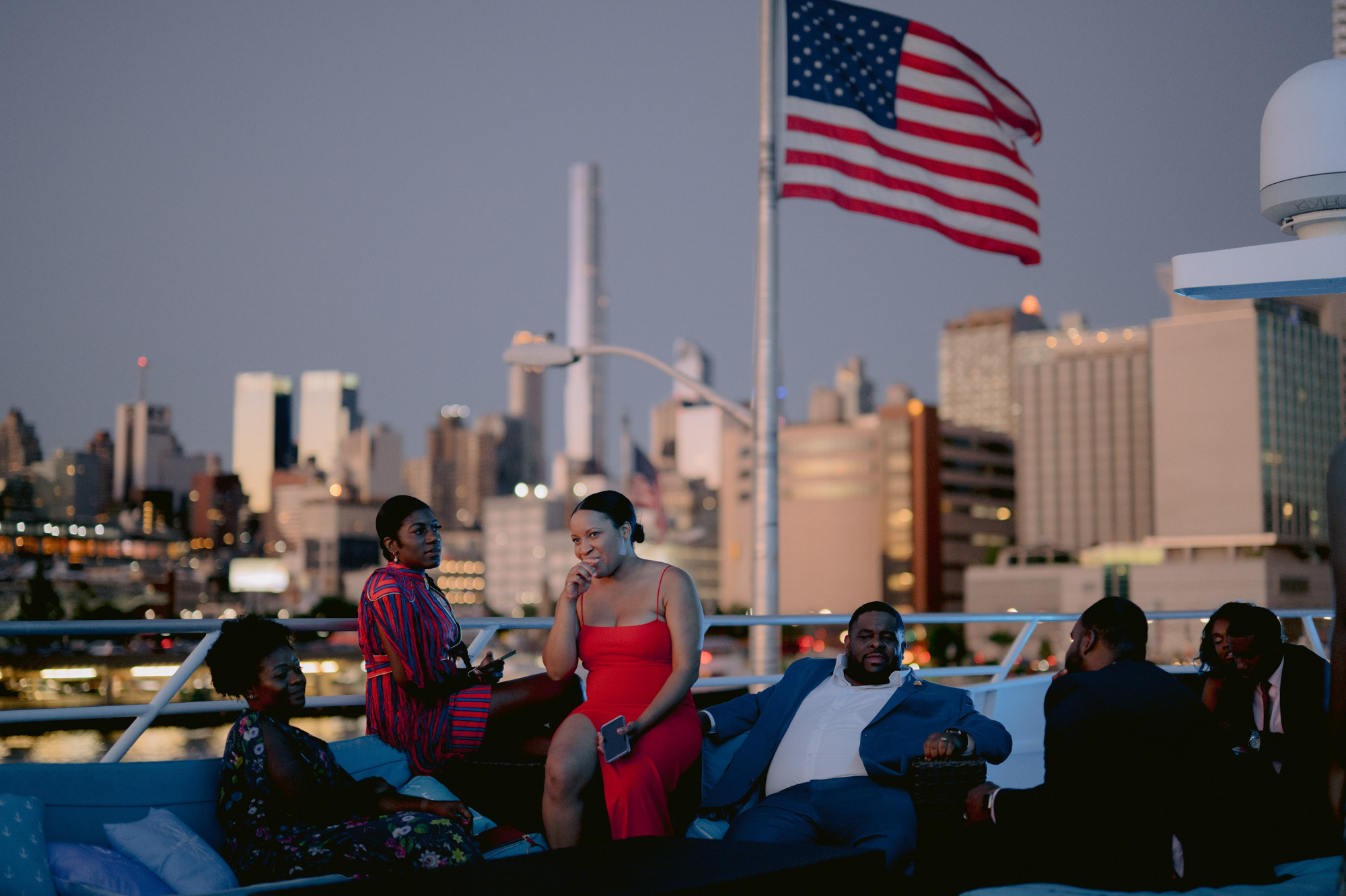 a group of people sitting on a boat