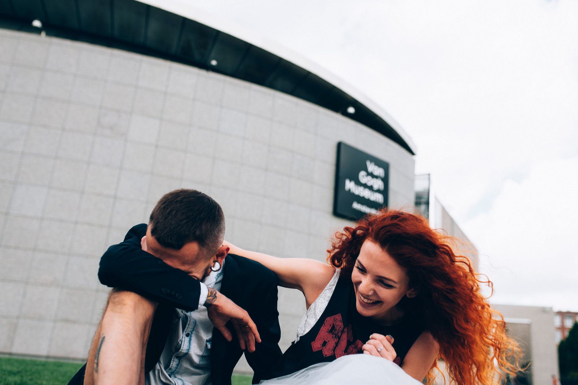 a man and woman are holding a baby