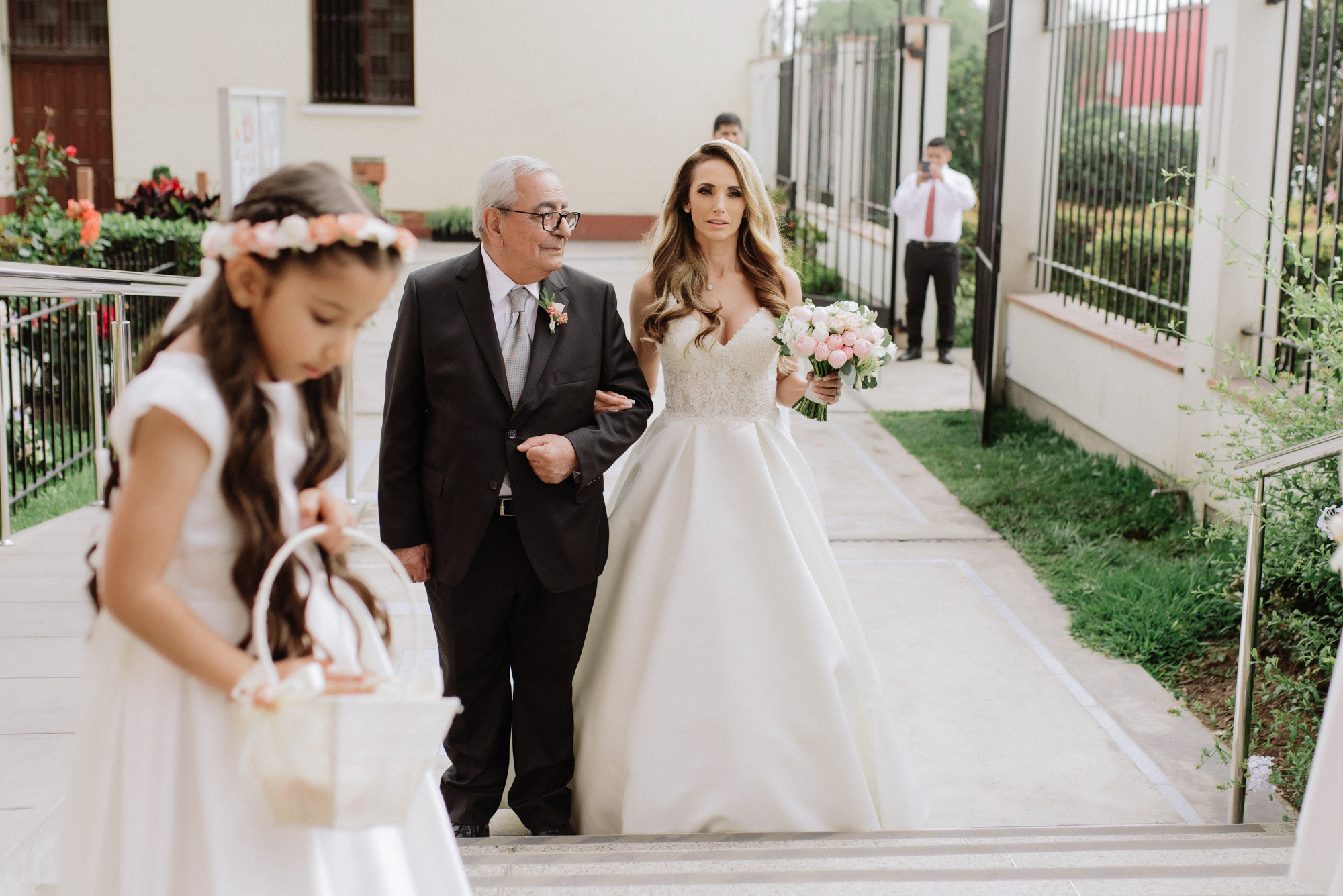 a bride and her father walking down the aisle