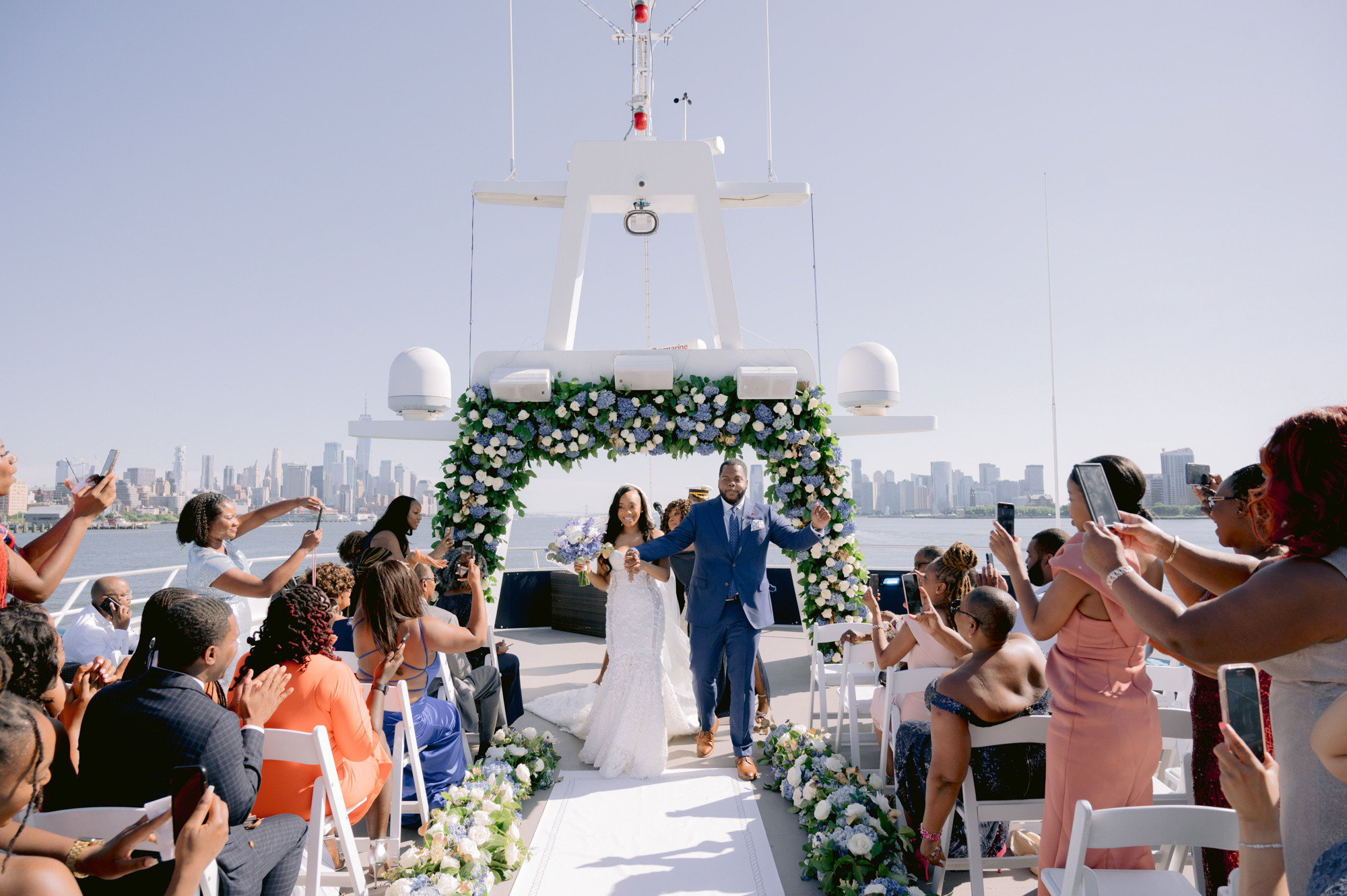a wedding ceremony on the deck of a boat