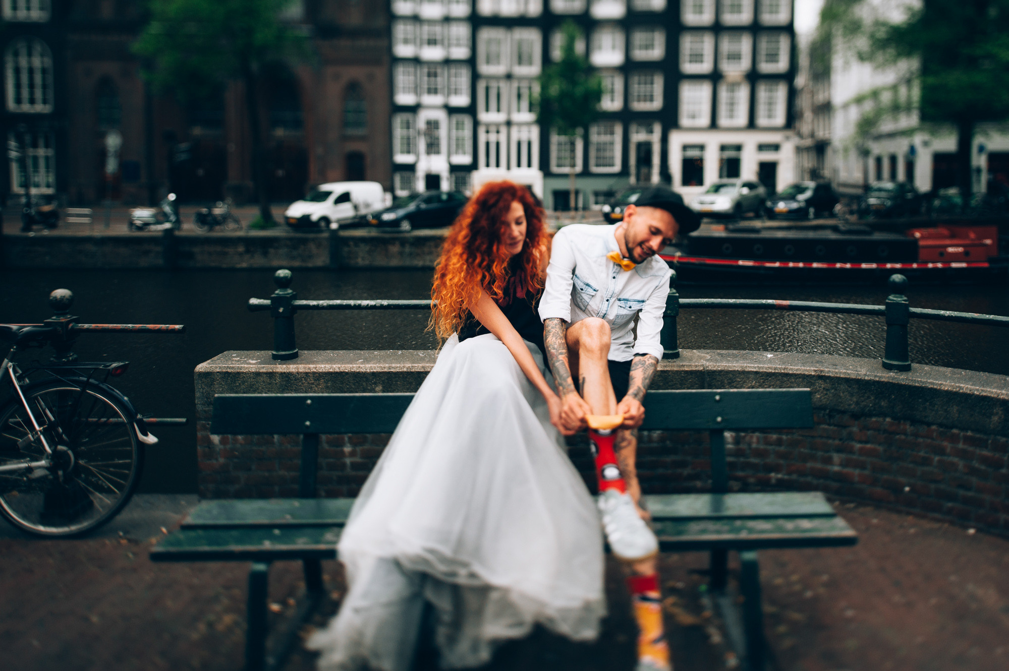 a man and woman sitting on a bench